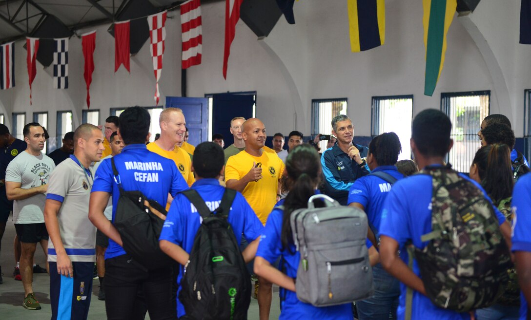 RIO DE JANEIRO (Sept. 5, 2022) Multinational forces welcome local children to a community relations event aimed at promoting cooperation and partnerships that was conducted prior to the beginning of UNITAS LXIII, Sept. 5, 2022. UNITAS is the world’s longest-running maritime exercise. Hosted this year by Brazil, it brings together multinational forces from Belize, Brazil, Cameroon, Chile, Colombia, Dominican Republic, Ecuador, France, Guyana, Jamaica, Mexico, Namibia, Panama, Paraguay, Peru, South Korea, Spain, United Kingdom, Uruguay, and the United States conducting operations in and off the coast of Rio de Janeiro. The exercise trains forces to conduct joint maritime operations through the execution of anti-surface, anti-submarine, anti-air, amphibious and electronic warfare operations that enhance warfighting proficiency and increase interoperability among participating naval and marine forces. (U.S. Navy photo by Mass Communication Specialist 1st Class Mitch Meppelink/Released)