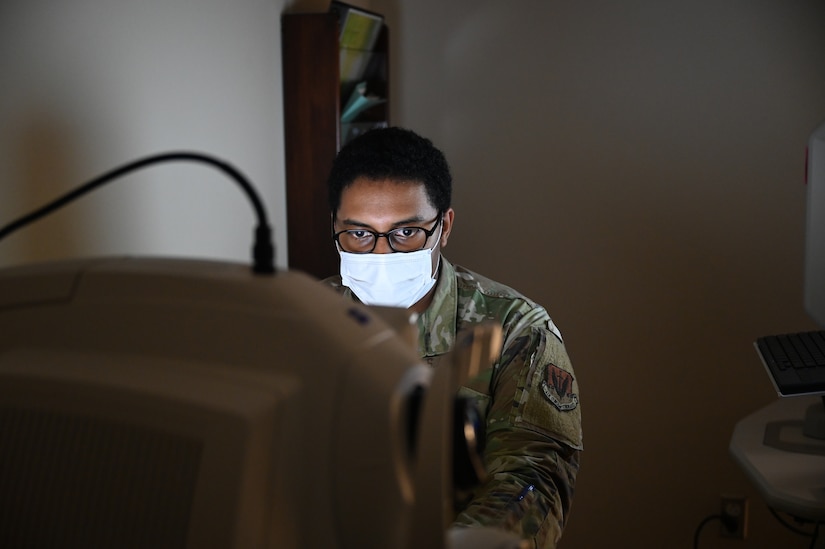 Airman utilizing a computer