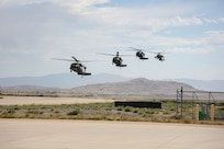 Four Black Hawk helicopters land at Dugway Proving Ground.