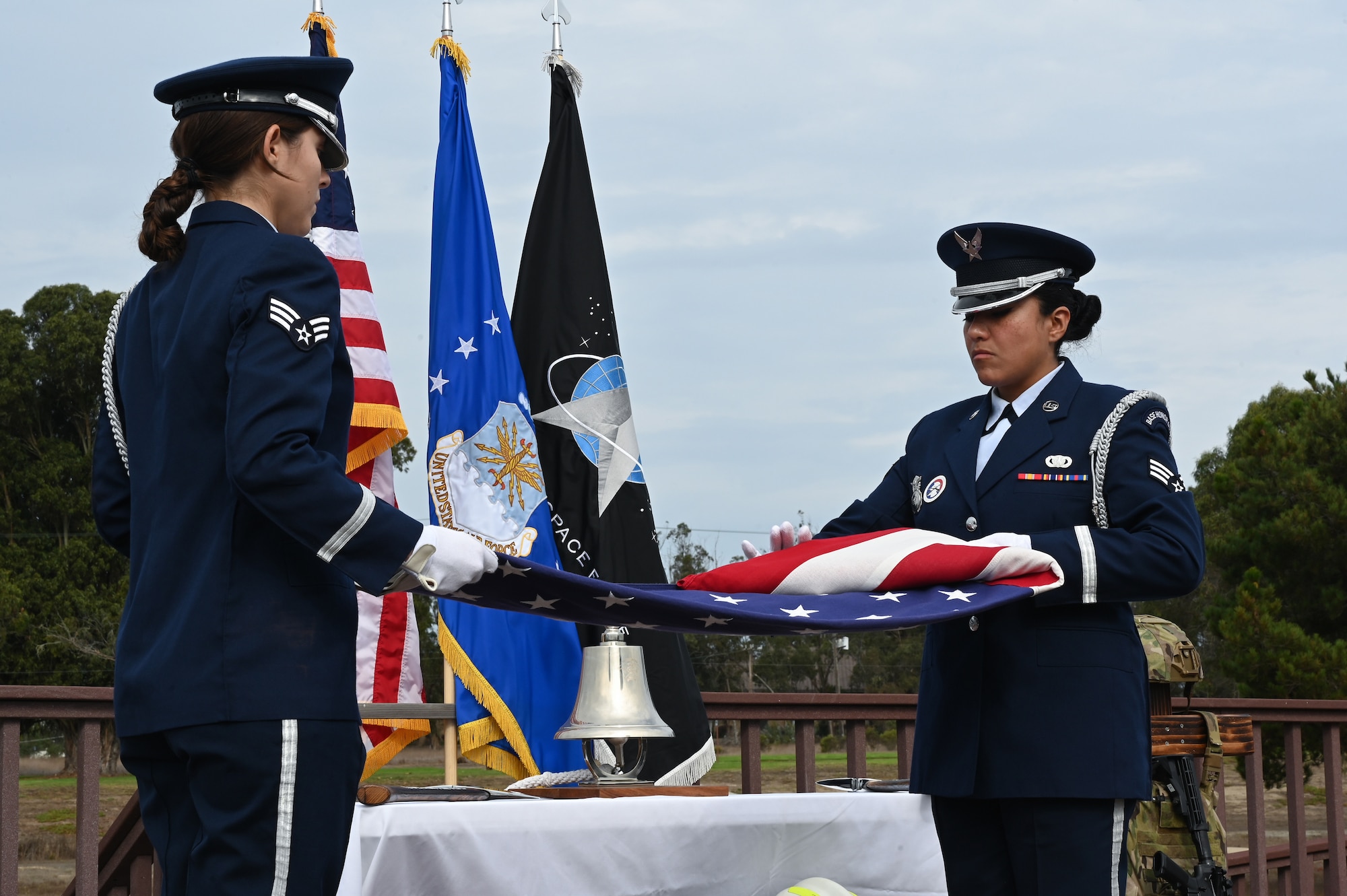 Two guardsmen fold the U.S. flag