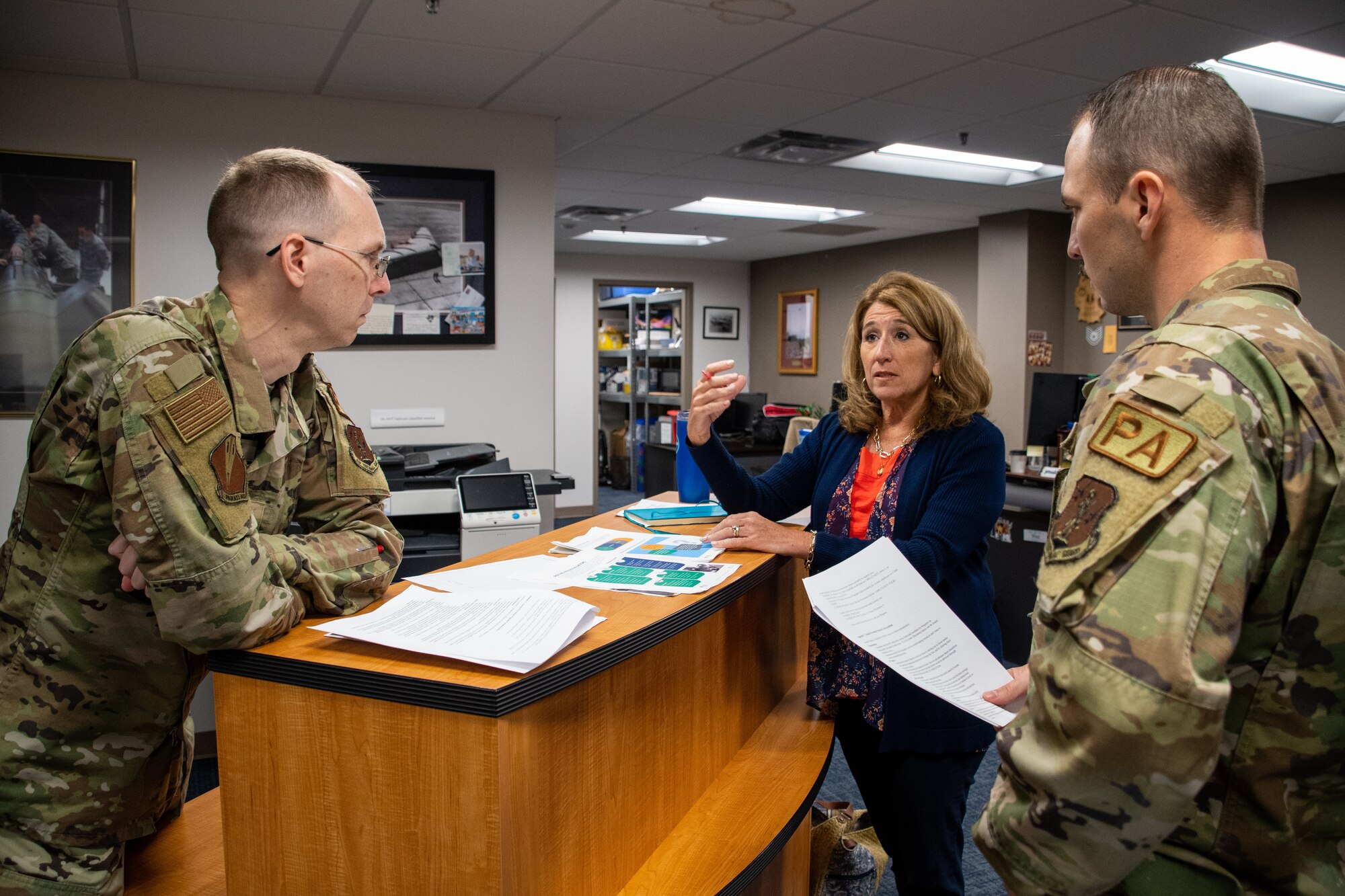 Bethany Harris, 131st Bomb Wing director of psychological health, discusses suicide prevention strategies with 131st public affairs staff at Whiteman Air Force Base, Missouri, Sept. 10, 2022. Harris was awarded the Air Force Association Outstanding Air Force Civilian Employee of the Year Award in the Civilian Program Manager category. (U.S. Air National Guard photo by Airman 1st Class Phoenix Lietch)