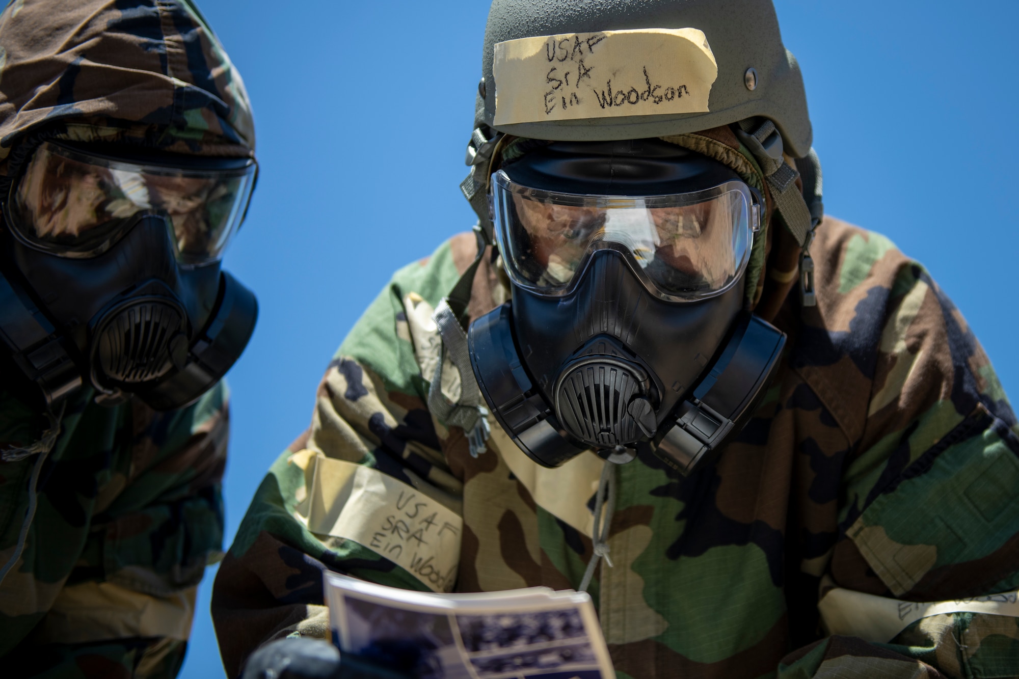 U.S. Air Force Senior Airman Ein Woodson, 607th Air Control Squadron surveillance technician, reviews response procedures during a chemical, biological, radiological, nuclear, and high-yield explosives scenario, during Exercise Crown Talon, May 4, 2022, at Luke Air Force Base, Arizona.