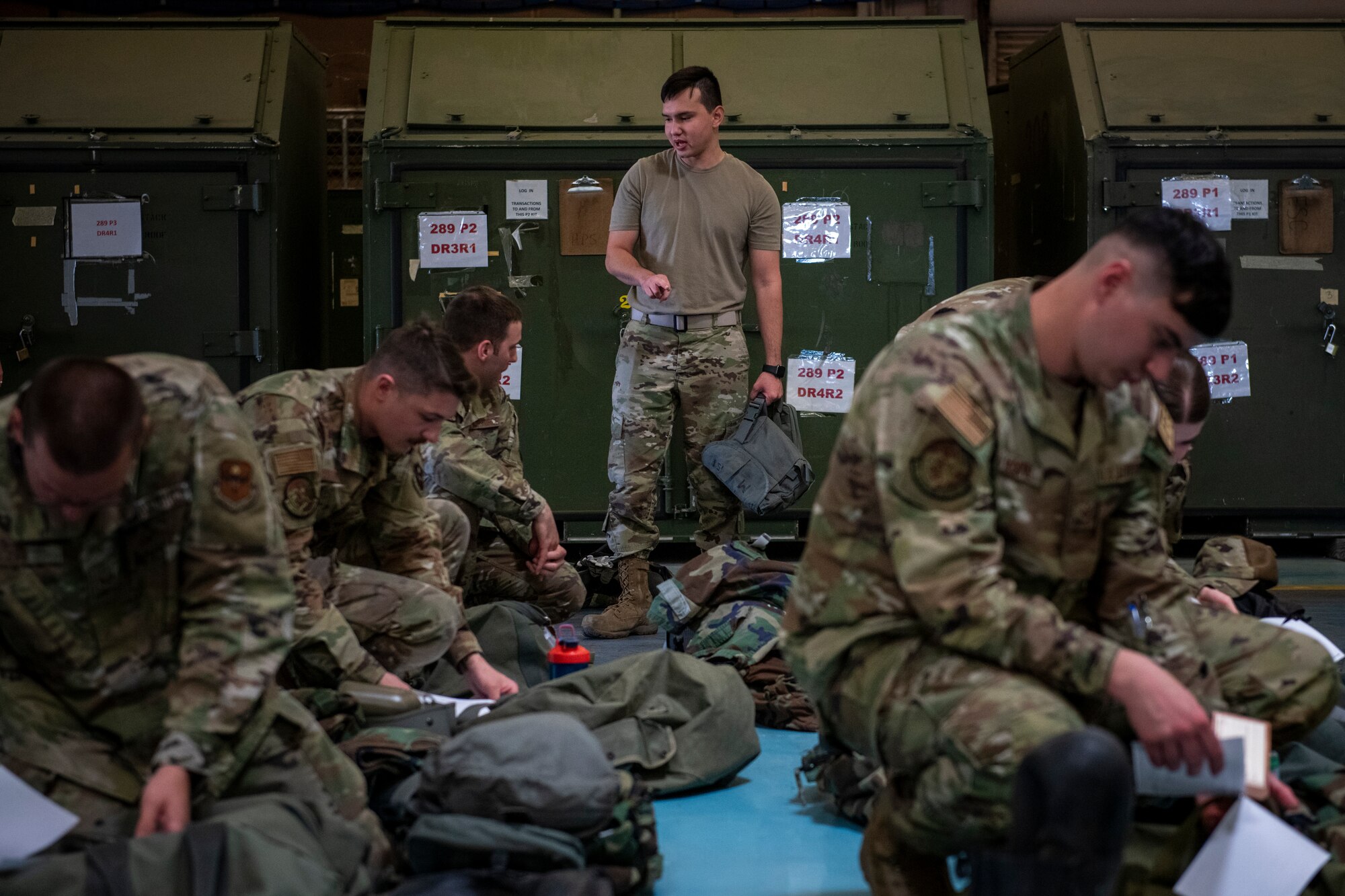 A U.S. Air Force Airman assigned to the 56th Logistics Readiness Squadron issues deployment gear to Airmen assigned to the 56th Fighter Wing, during exercise Crown Talon May 4, 2022, at Luke Air Force Base, Arizona.