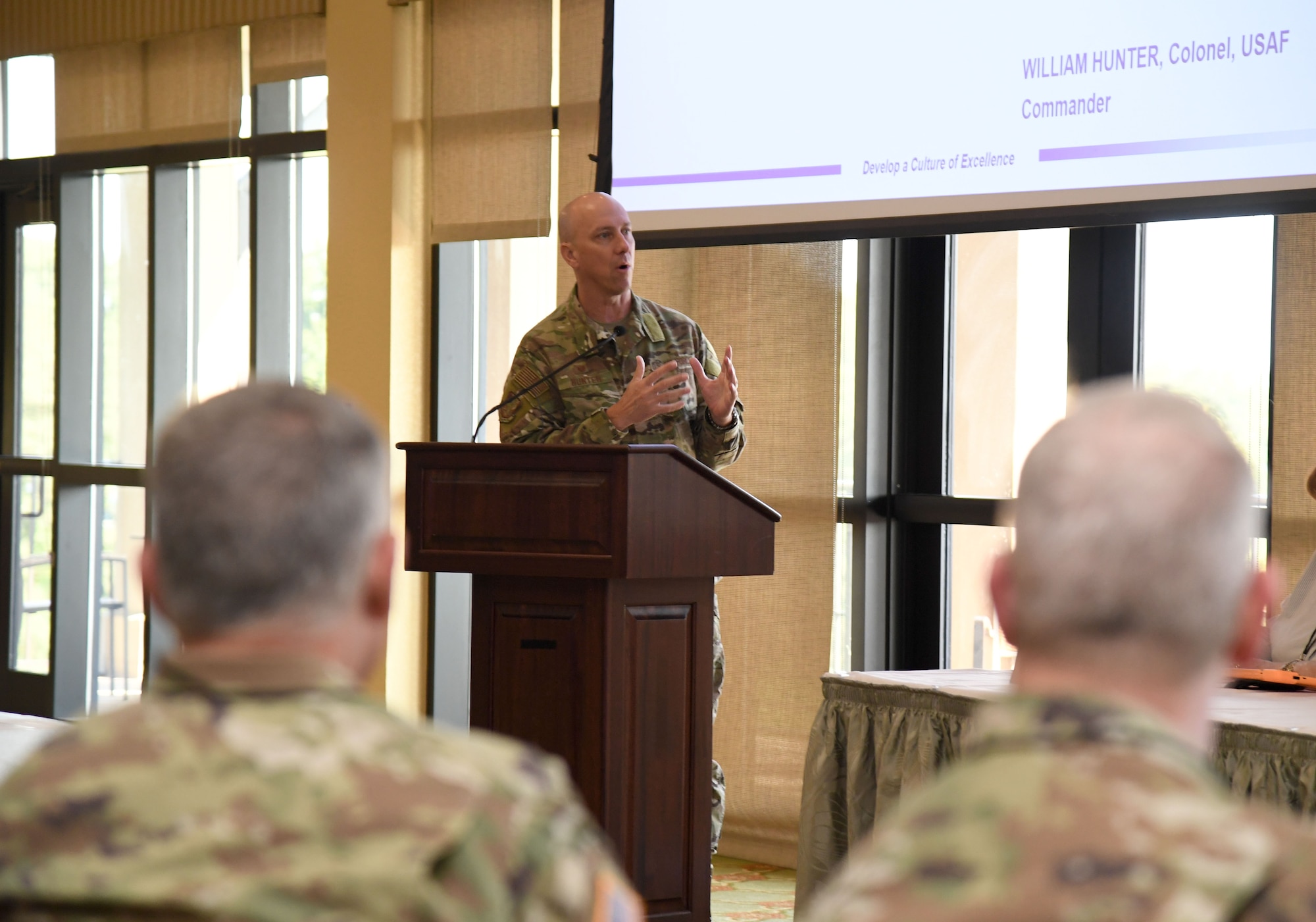 U.S. Air Force Col. William Hunter, 81st Training Wing commander, delivers a brief during the Industry Day Exchange Proposed Mixed-Use Enhanced Use Lease meeting inside the Bay Breeze Event Center at Keesler Air Force Base, Mississippi, Sept. 15, 2022. The Air Force Civil Engineer Center and 81st Training Wing hosted the event to explore the possibility of a Cyber Processing Center opportunity at Keesler. (U.S. Air Force photo by Kemberly Groue)