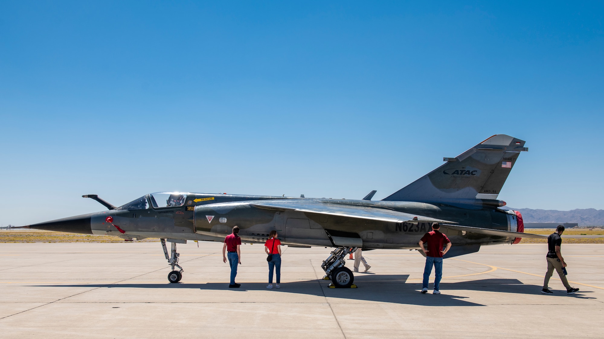 Luke Air Force Base supporters and civic leaders from the Phoenix Metropolitan area walk around and observe a Mirage F1 fighter jet, during the Luke AFB Supporter Appreciation Day event, May 13, 2022, at Luke AFB, Arizona.
