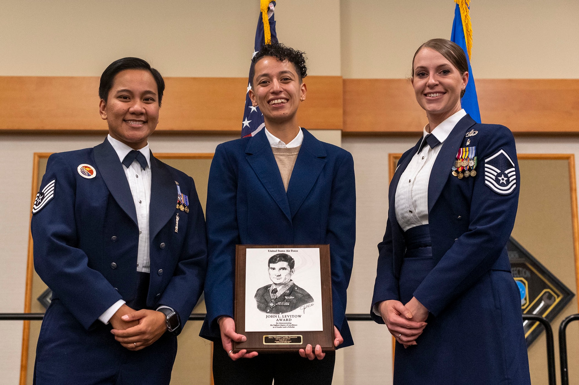 Viviana Castillo Ramirez (middle), 341st Contracting Squadron contracting specialist, poses for a photo with Tech. Sgt. Jane Nucal (left), 341st Missile Wing Airman Leadership School instructor, and Master Sgt. Christiana Ritenour, 341st MW ALS commandant, after graduating from ALS with the John Levitow Award Sep. 15, 2022, at Malmstrom Air Force Base, Mont. The Levitow Award is the highest honor awarded in a professional military educational environment and is given to the student who achieves the highest overall standing from a combination of academic scores, performance evaluations and leadership qualities. (U.S. Air Force photo by Airman 1st Class Elijah Van Zandt)