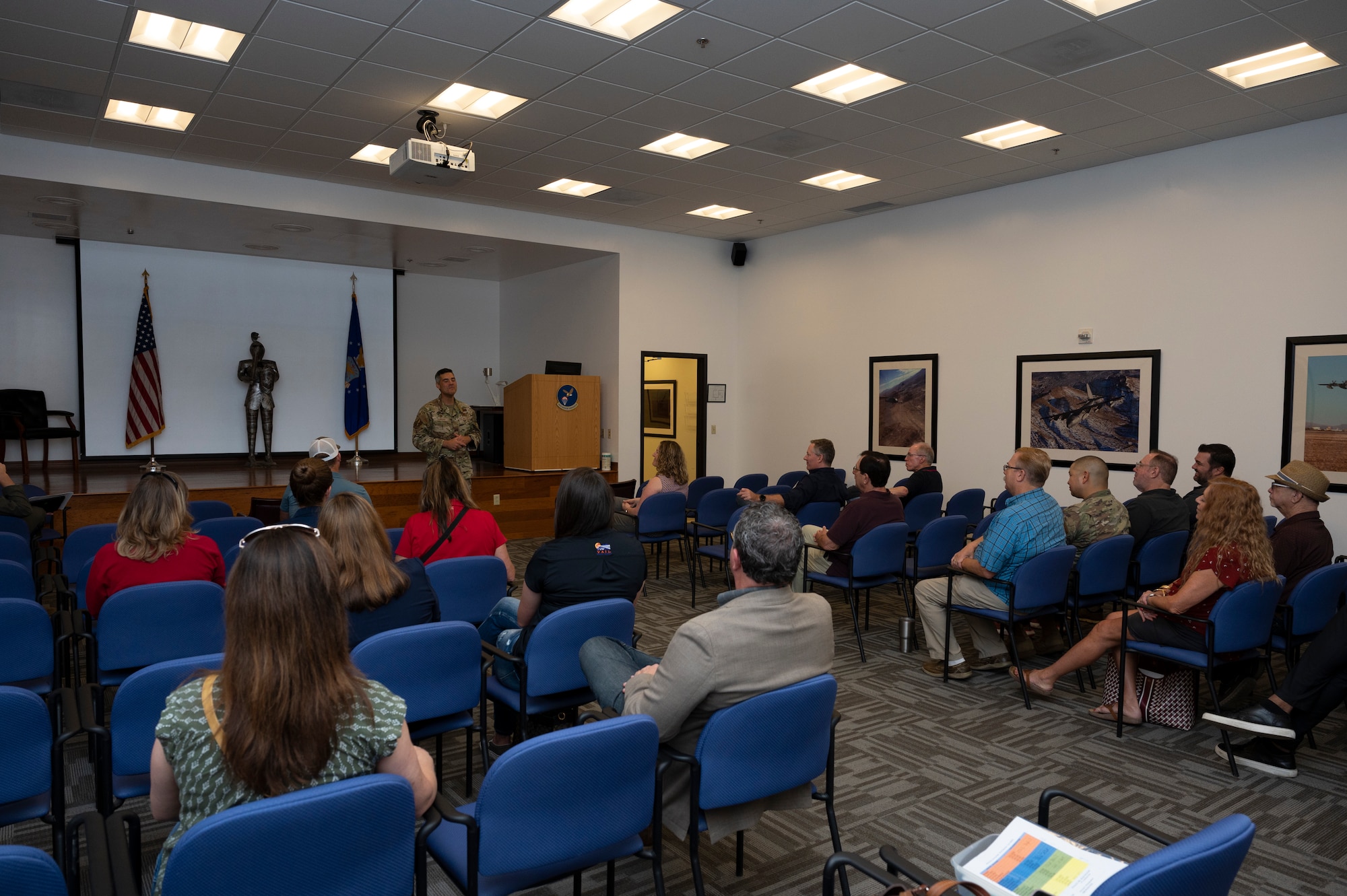 A photo of a man speaking to an audience