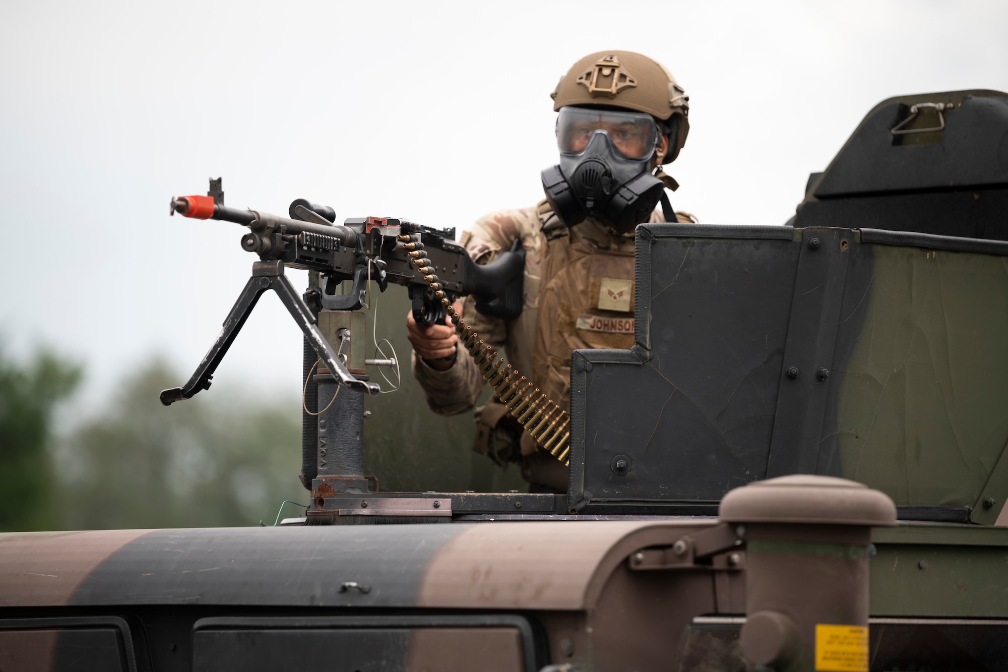 U.S. Air Force Senior Airman Damian Johnson, 51st Security Forces Squadron defender, scans his area of responsibility during a “Defend the Base” training scenario