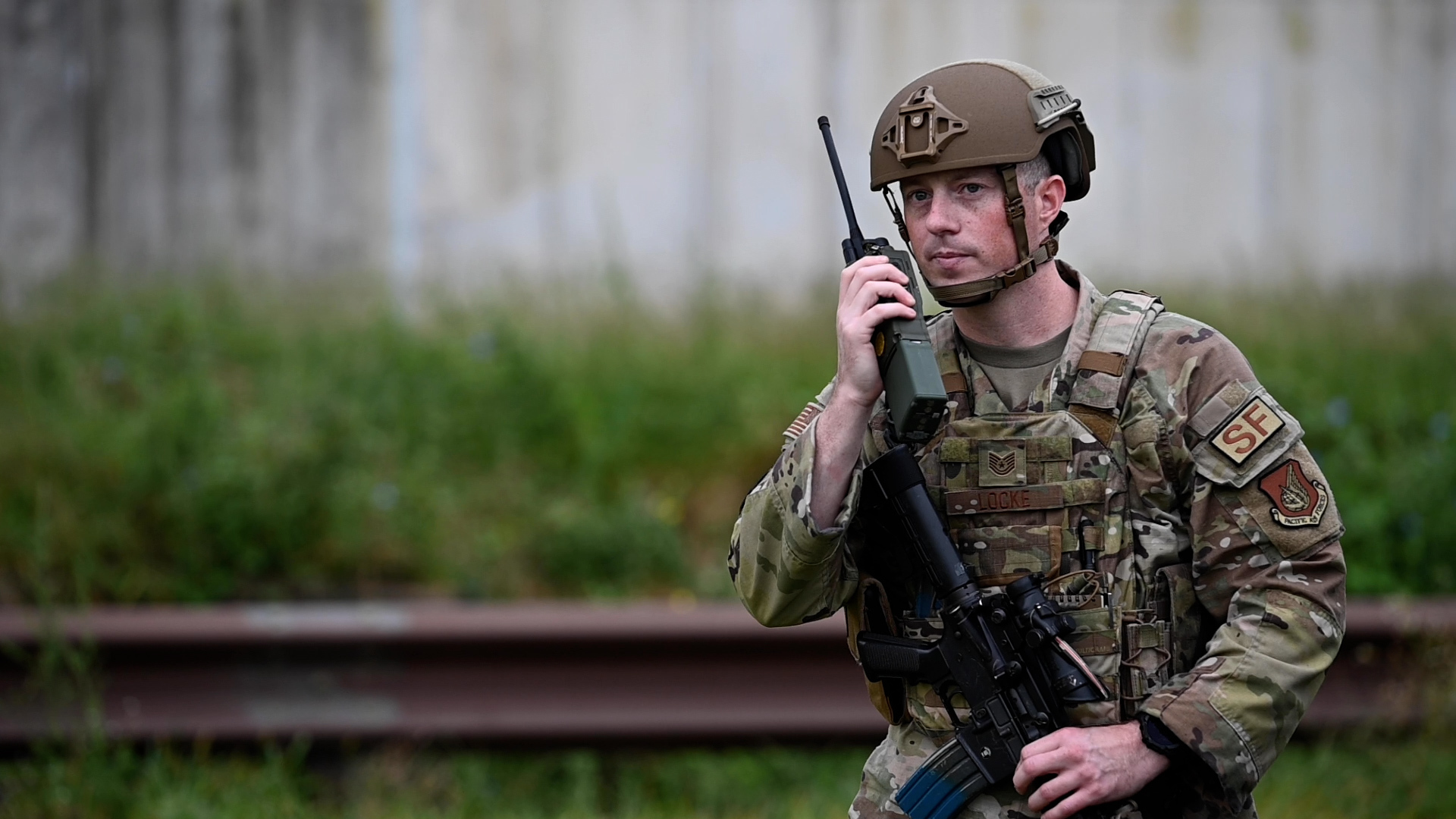 U.S. Air Force Tech. Sgt. Jordan Locke, 51st Security Forces Squadron defender, calls in a possible drone sighting during a training scenario
