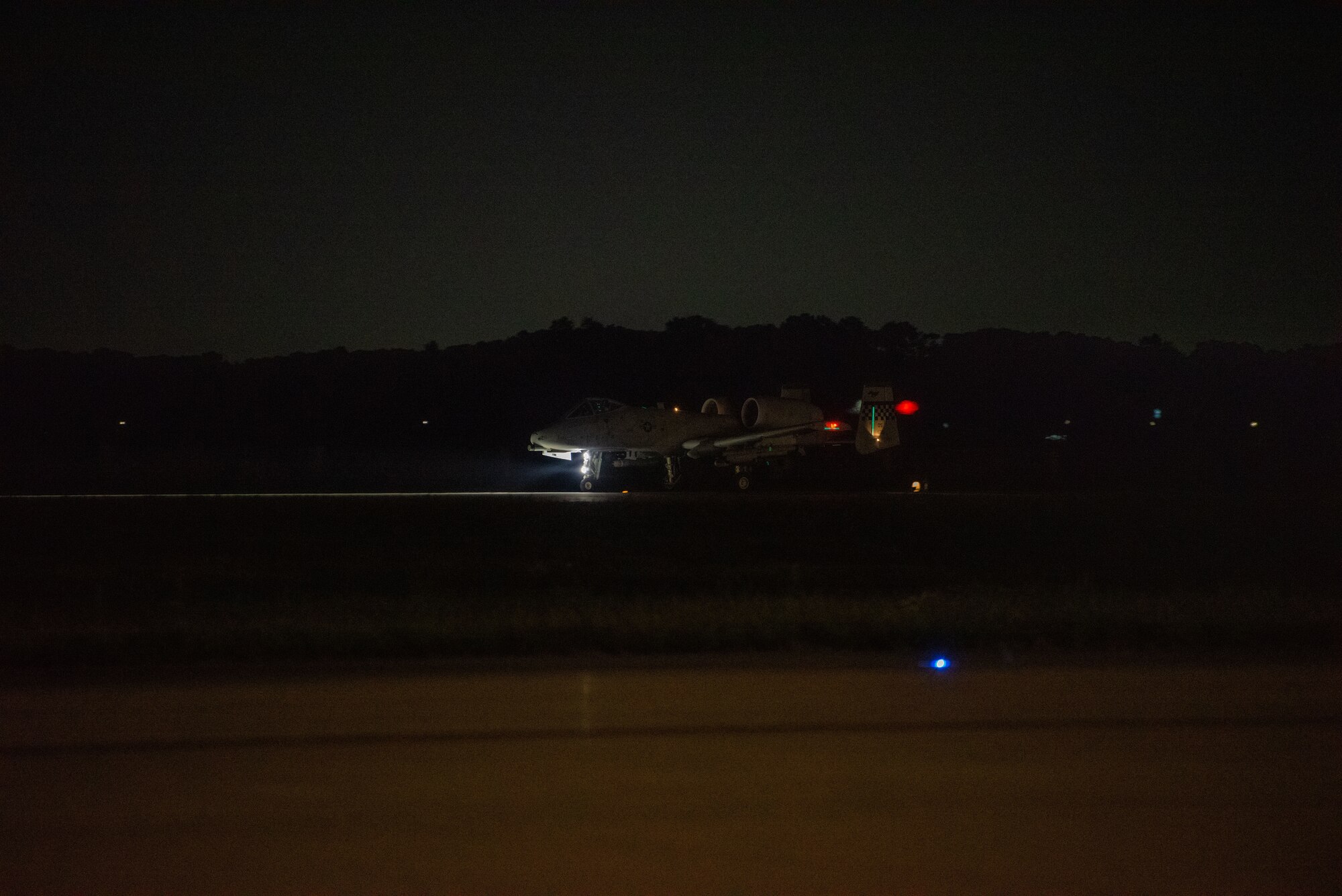 An A-10 Thunderbolt II from the 25th Fighter Squadron lands on a runway after flying a night sortie for a wing training event at Osan Air Base, Republic of Korea, Sept. 14, 2022.