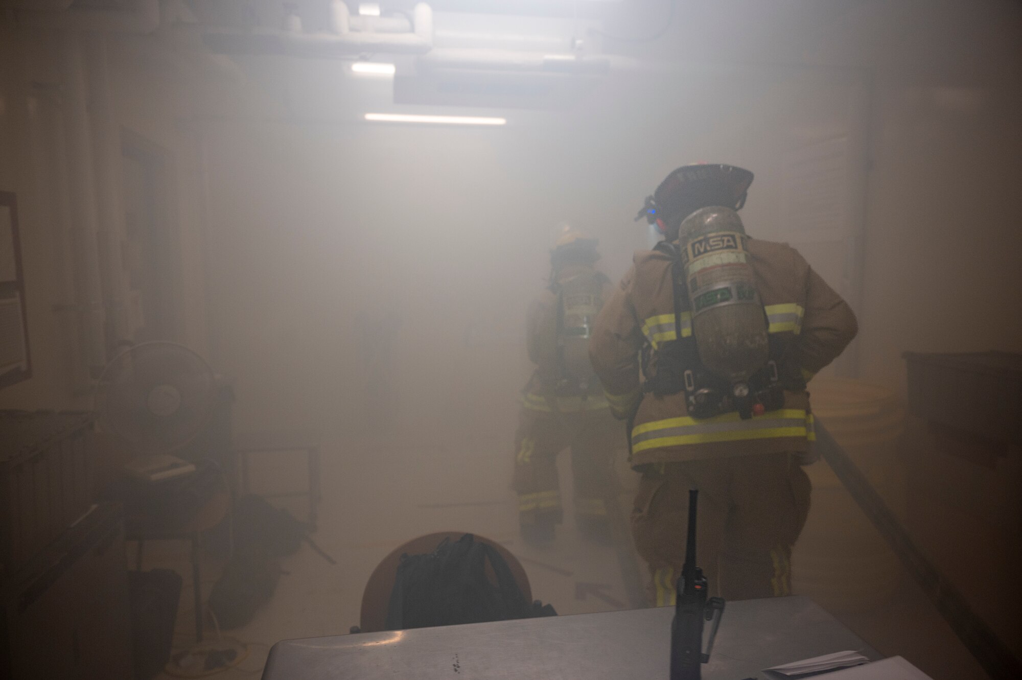 U.S. Air Force Firefighters assigned to the 51st Civil Engineer Squadron, enter a smoke-filled building during a fire response training scenario at Osan Air Base, Republic of Korea, Sept. 14, 2022.