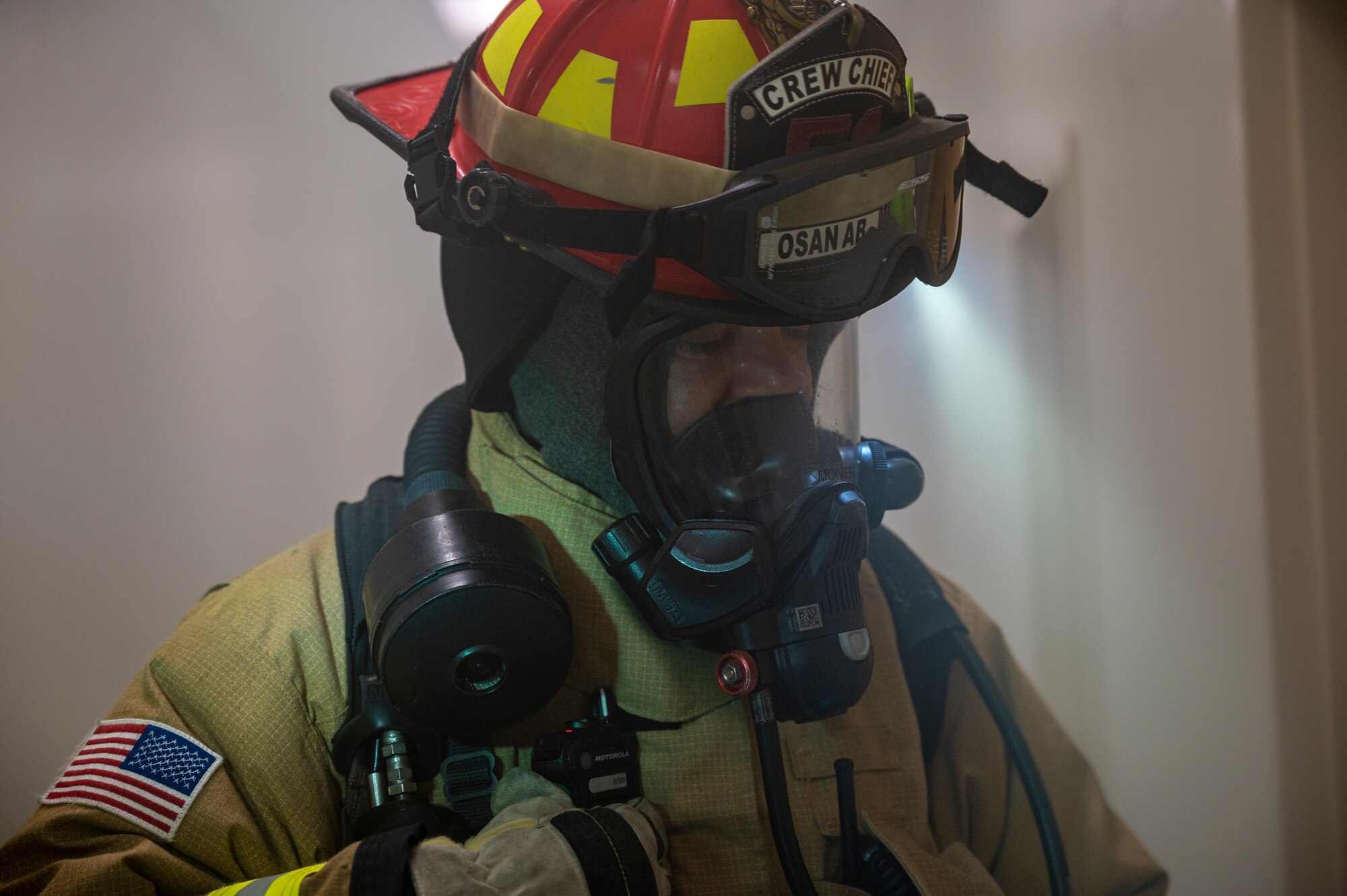 U.S. Air Force Staff Sgt. Larry McIver, 51st Civil Engineer Squadron lead firefighter, responds to radio traffic during a fire response training scenario at Osan Air Base, Republic of Korea, Sept. 14, 2022.