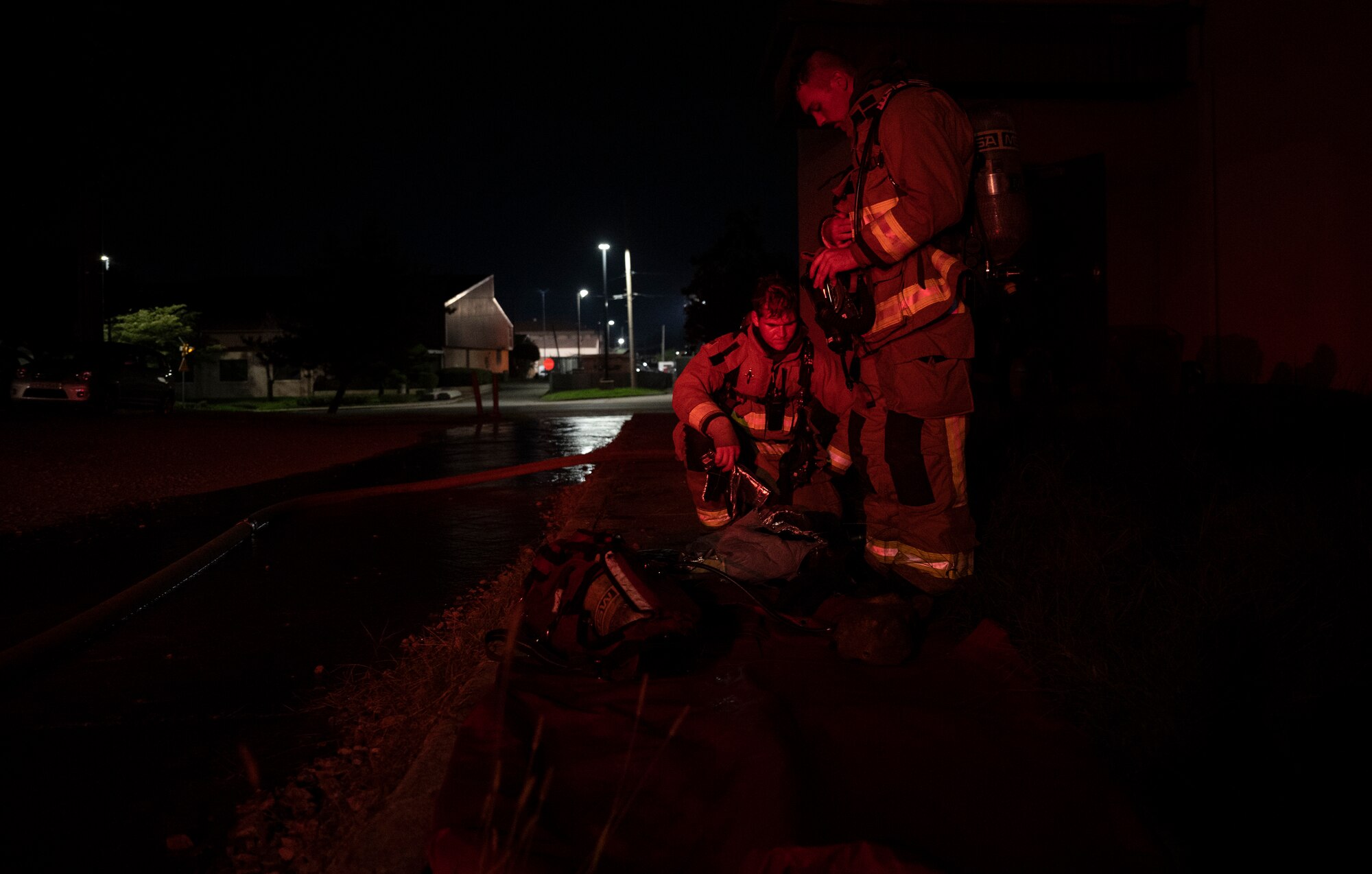 U.S. Air Force Firefighters assigned to the 51st Civil Engineer Squadron (CES) remove their gear after a fire response training scenario at Osan Air Base, Republic of Korea, Sept. 14, 2022.