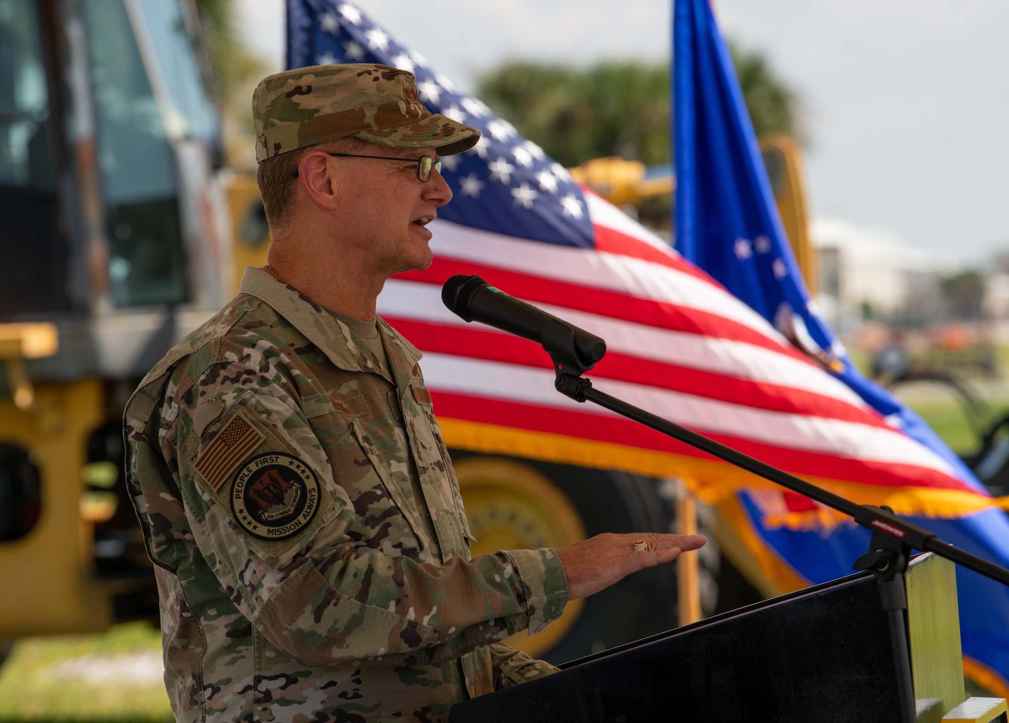 man speaks during ceremony