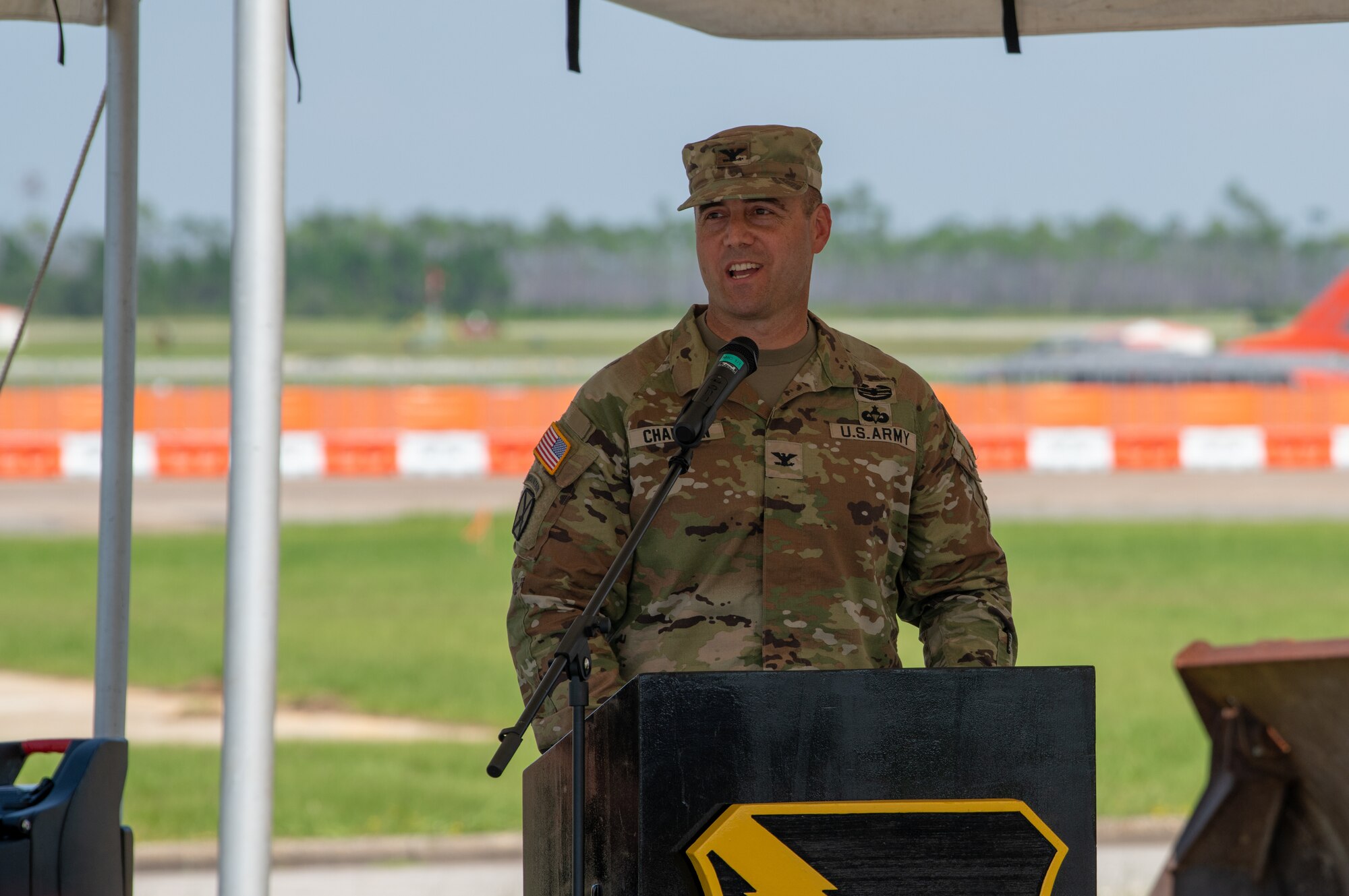 man speaks during ceremony