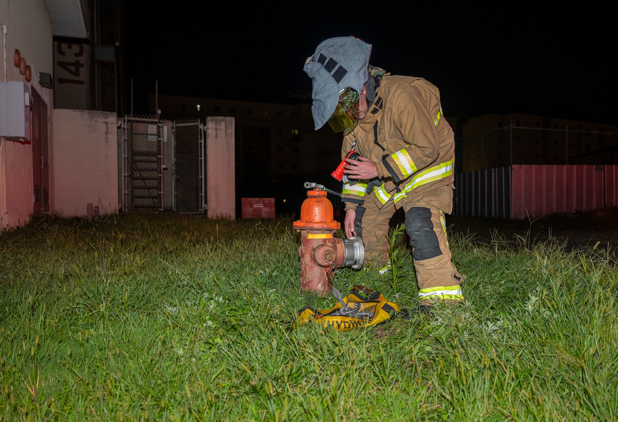 U.S. Air Force Airman 1st Class Brendan Casserly, 51st Civil Engineer Squadron firefighter, opens a fire hydrant during a fire response scenario at Osan Air Base, Republic of Korea, Sept. 14, 2022.