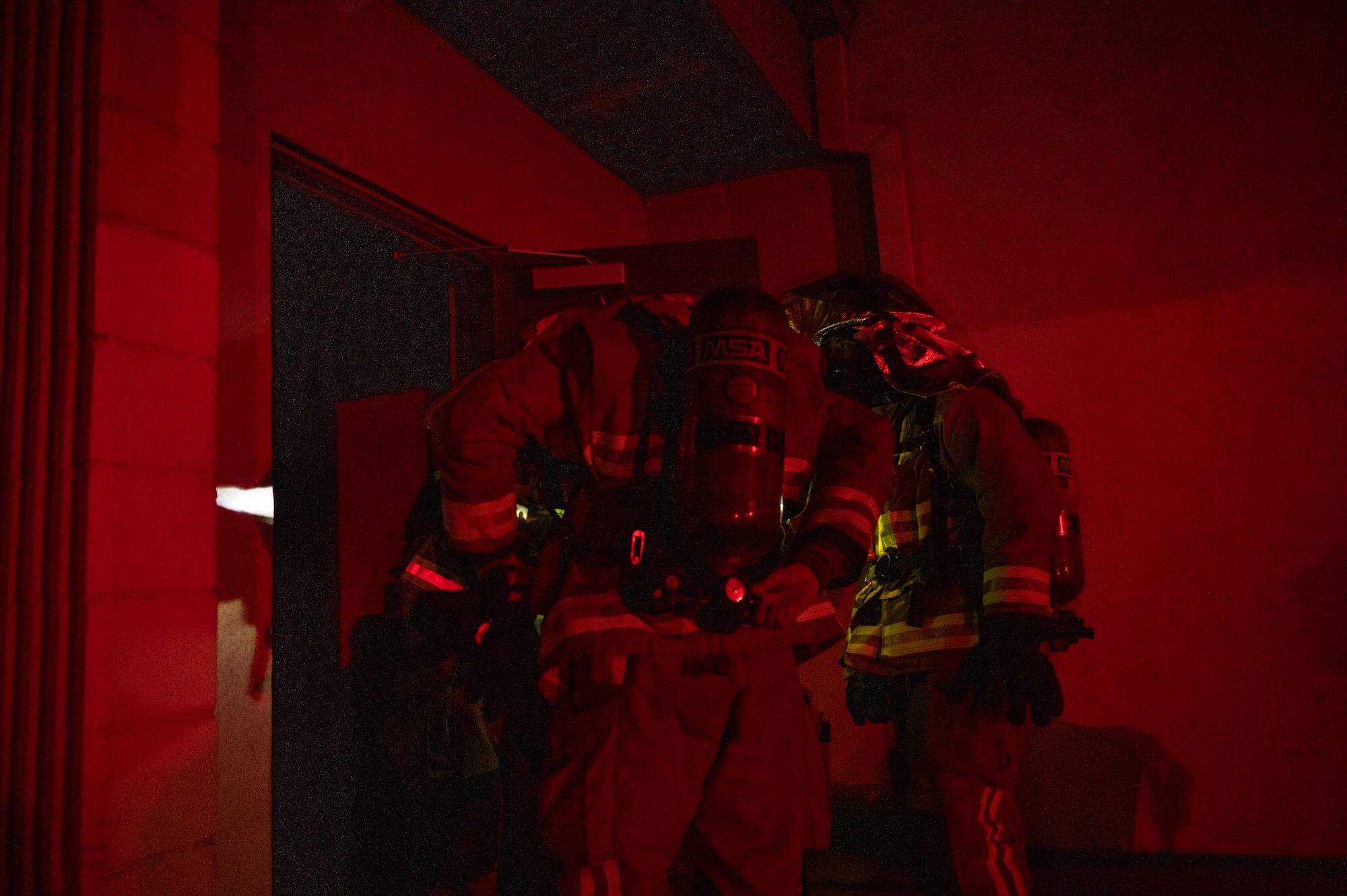 U.S. Air Force Firefighters assigned to the 51st Civil Engineer Squadron (CES), prepare to enter a building during a fire response training scenario at Osan Air Base, Republic of Korea, Sept. 14, 2022.