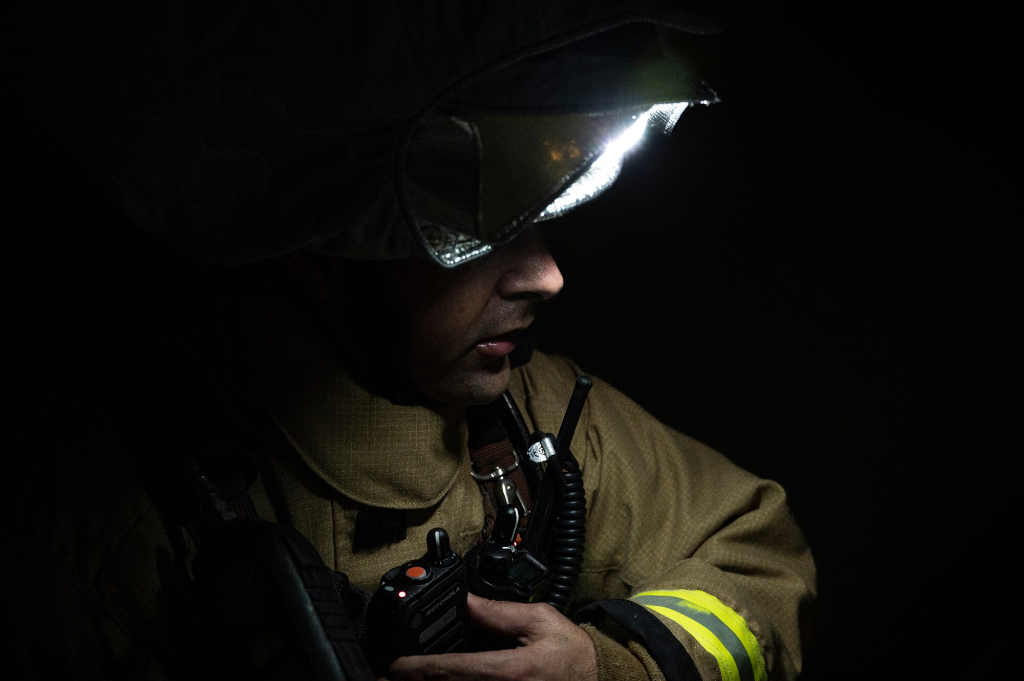 U.S. Air Force Staff Sgt. Larry McIver, 51st Civil Engineer Squadron lead firefighter, responds to radio traffic during a fire response training scenario at Osan Air Base, Republic of Korea, Sept. 14, 2022.