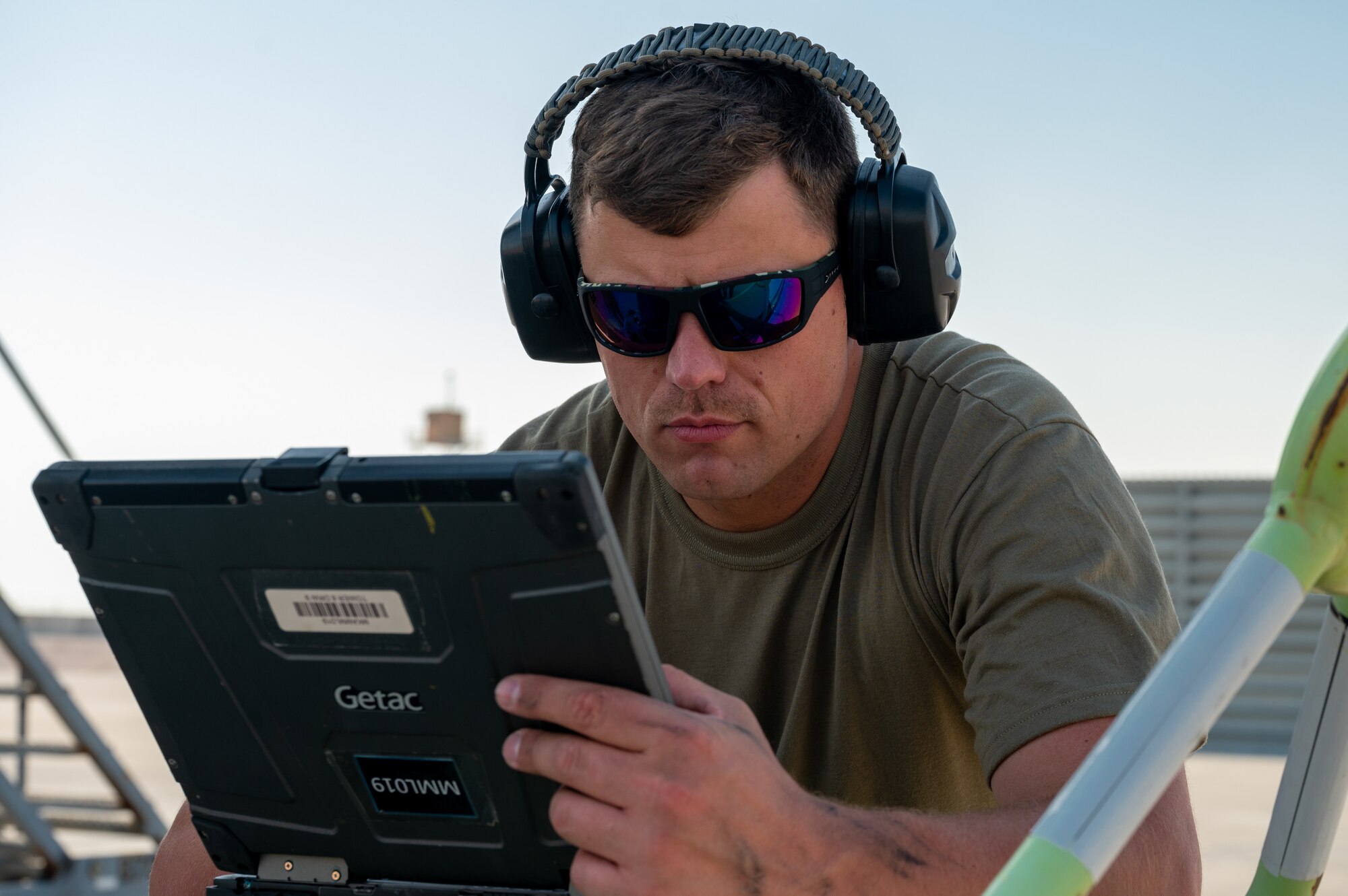 U.S. Air Force Tech. Sgt. Tommy James, 22nd Maintenance Squadron repair and restoration craftsman, uses a laptop during a preflight inspection Aug. 30, 2022, at Al Udeid Air Base, Qatar.