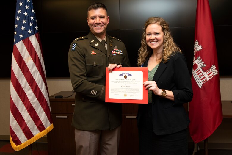 Cathy Keith, U.S. Army Corps of Engineers Nashville District, receives the Department of the Army Civilian Service Achievement Medal from Lt. Col. Joseph Sahl, Nashville District commander, during a graduation ceremony Sept. 14, 2022, at the district headquarters in Nashville, Tennessee. She received the award for her work as program facilitator for the 2022 Leadership Development Program Level II Course. (USACE Photo by Lee Roberts)
