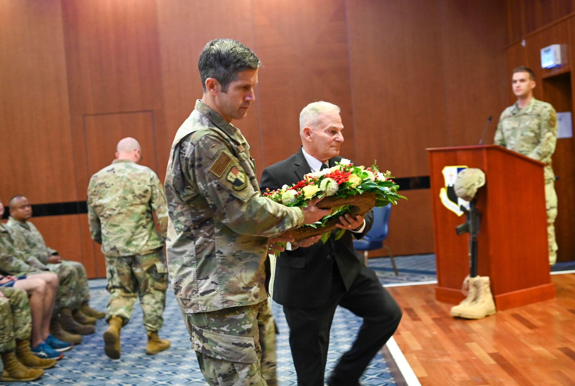 Col. William McKibban, 52nd Fighter Wing vice commander, and Hubert Caloud, superintendent of the Oise-Aisne American cemetery, France, pay tribute to prisoners of war and those missing in action by laying a wreath.