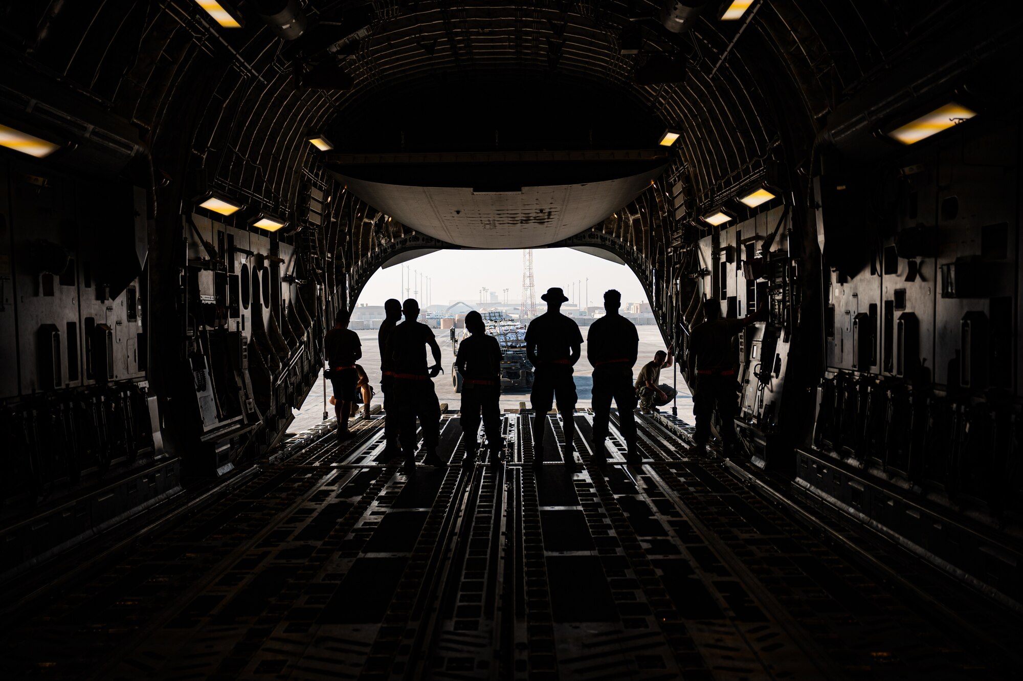 U.S. military personnel assigned to United States Central Command load critical supplies into a U.S. Air Force C-17A Globemaster III aircraft in support of a USAID-led humanitarian mission to Pakistan from Al Udeid Air Base, Qatar, Sep. 14, 2022. USAID leads the U.S. Government's international development and disaster assistance, helping people emerge from humanitarian crises, such as the catastrophic flooding currently plaguing Pakistan. (U.S. Air Force photo by Staff Sgt. Dana Tourtellotte)