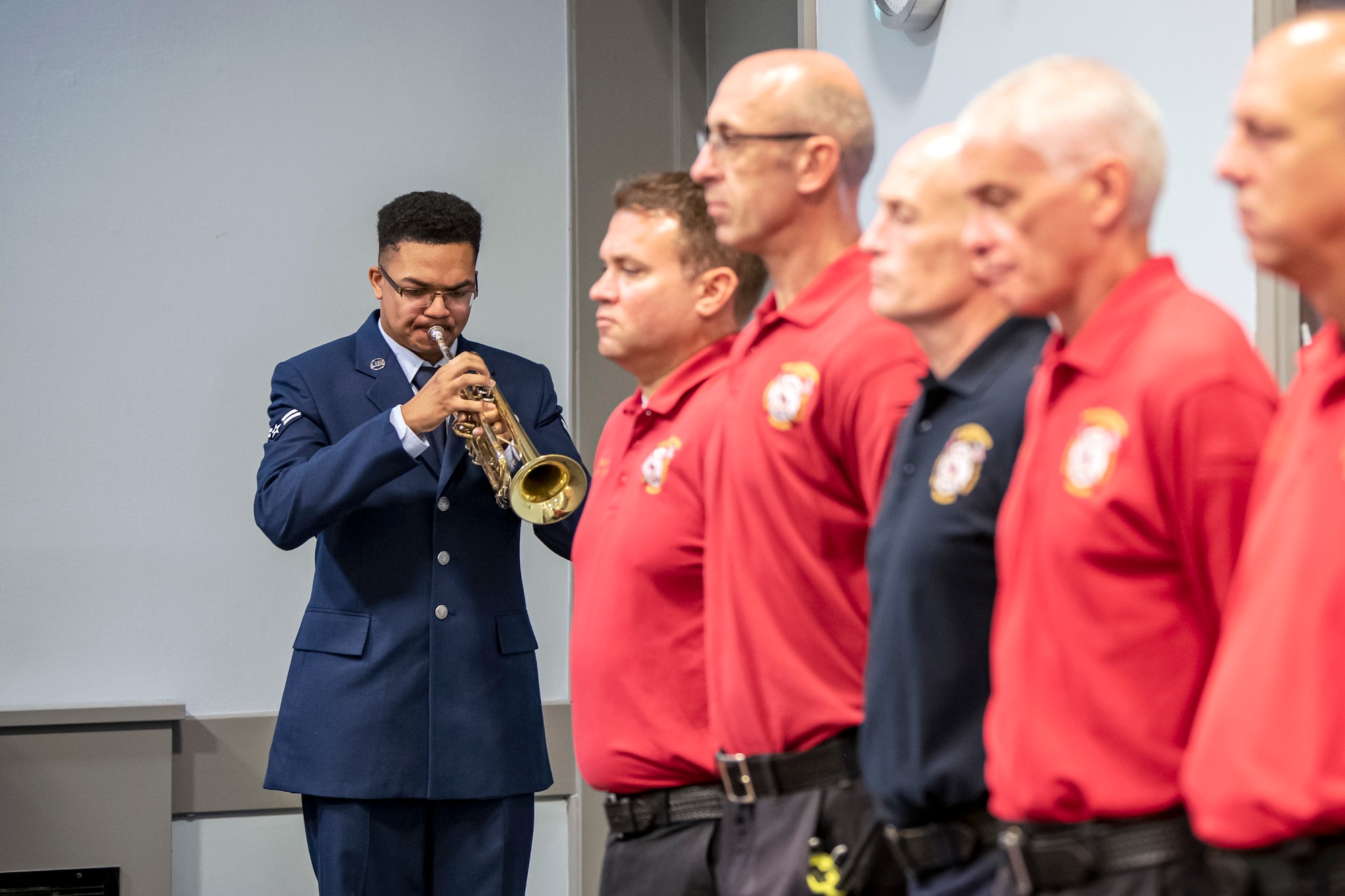 An Airman from the 422d Air Base Group, plays the bugle during a 9/11 retreat ceremony at RAF Croughton, England, Sep. 9, 2022. Airmen and guests participated in the ceremony to honor those who lost their lives during the September 11th terrorist attacks. (U.S. Air Force photo by Staff Sgt. Eugene Oliver)