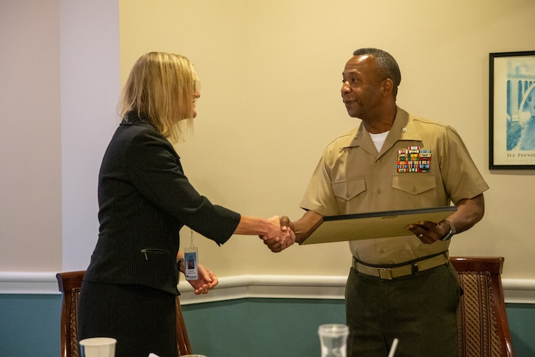 Carol Flenard, Prince William County Public Schools Deputy Superintendent, receives the Pete Taylor Partnership of Excellence Award from U.S. Marine Corps Col. Michael L. Brooks, commanding officer, Marine Corps Base Quantico at The Clubs of Quantico, Sept. 9, 2022. The Pete Taylor Partnership of Excellence Award recognizes successful partnerships and projects that ultimately benefit military-connected children. Prince William County Schools’ dedication to “Providing A World-Class Education” focuses learning and achieving exacting standards that support the academic, social, and emotional needs of all students. (U.S. Marine Corps photo by Cpl. Eric Huynh)