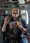 (Aug. 31, 2022) Cmdr. Miles Alvarez, assigned to the the George H.W. Bush Carrier Strike Group (GHWBCSG), is promoted to commander during a promotion ceremony aboard an MH-60S Nighthawk helicopter attached to Helicopter Sea Combat Squadron (HSC) 5, Aug. 31, 2022. The GHWBCSG is on a scheduled deployment in the U.S. Naval Forces Europe area of operations, employed by U.S. Sixth Fleet to defend U.S., allied and partner interests.