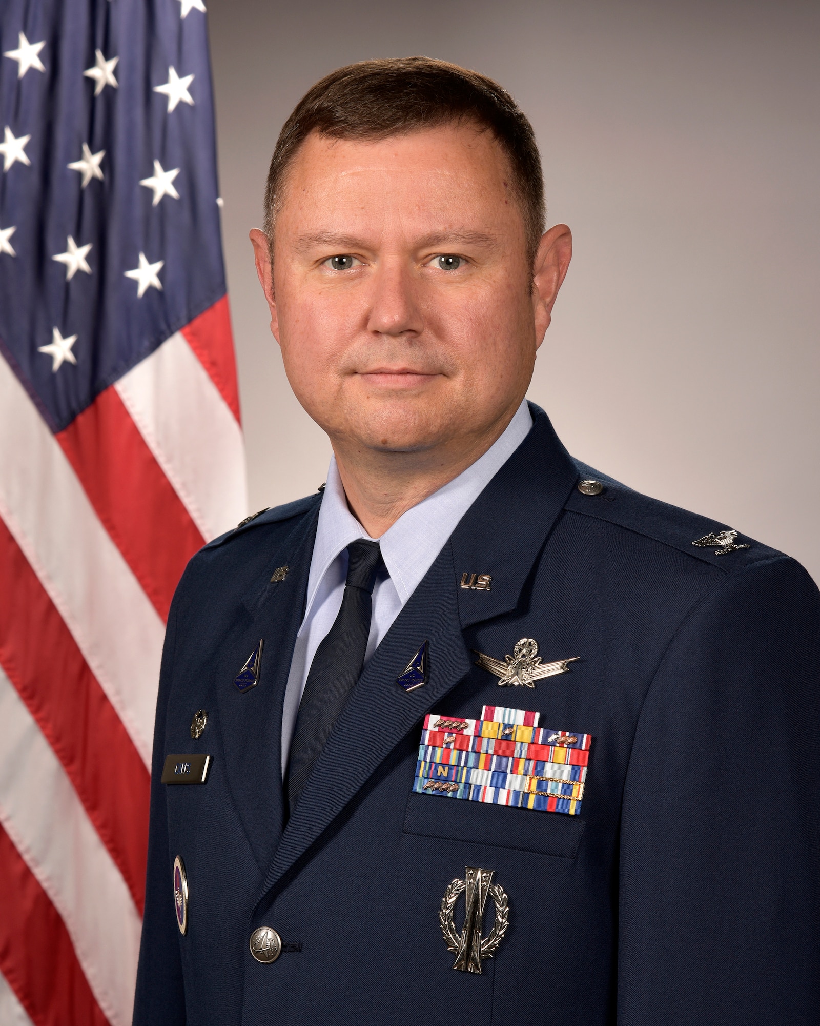 U.S. Space Force Col. Brian Capps, 821st Space Base Group commander, poses for an official photo at Peterson Space Force Base, Colorado, Aug. 24, 2022. The 821st SBG enables force projection, space superiority and scientific research in the Arctic Region for our nation and allies. (U.S. Space Force photo by Craig Denton)