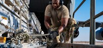 A U.S. Airman, assigned to the 332nd Expeditionary Logistics Readiness Squadron, secures cargo to a K-loader during a mission in support of Combined Joint Task Force - Operation Inherent Resolve in the U.S. Central Command area of responsibility, Aug. 14, 2021. CJTF-OIR enables its partners to ensure the enduring defeat of ISIS in designated areas of Iraq and Syria and sets conditions for follow-on operations to increase regional stability. (U.S. Air Force photo illustration by Senior Airman Taylor Crul)