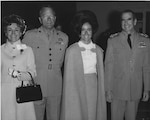Chief of Naval Operations Lieutenant Elmo “Bud” Zumwalt and Mouza Zumwalt (right) attend a luncheon with Commandant of the Marine Corps General Leonard Chapman and Emily Champan (left).
