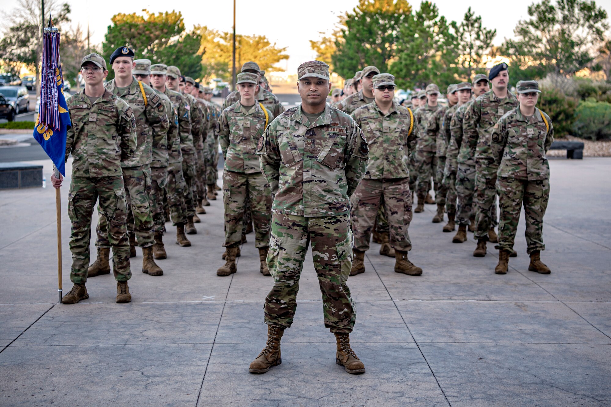 Space Base Delta 1 Airmen and Guardians stand in formation during the SBD 1 POW/MIA reveille ceremony at Schriever Space Force Base, Colorado, Sept. 12, 2022. The reveille ceremony is the first event to be held on the base in observance of the 2022 POW/MIA Remembrance Week. (U.S. Space Force Photo by Tiana Williams)
