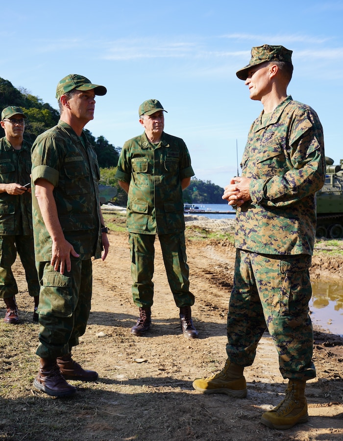 Vice-Almirante Carlos Chagas Vianna Braga, left, and Vice-Almirante Renato Garcia Arruda, center, Vice Admirals in the Brazilian Marine Corps and senior commanders within the fleet marine forces, discuss amphibious operations with Brig. Gen. Len "Loni" Anderson, right, commanding general of 4th Marine Aircraft Wing, Marine Forces Reserve, during the kick off of UNITAS LXIII at Ilha do Governador, Rio de Janeiro, Sept. 6, 2022. The senior leaders within both nations’ Marine Corps discuss the importance of combined planning and training efforts to retain strong partnerships and ensure their forces are ready when needed. UNITAS, throughout its 63 iterations, has proven to develop and sustain relationships that improve the capacity of our reemerging and enduring maritime partners to achieve common objectives. Additionally, the military-to-military exchanges foster mutual cooperation, understanding, and respect among participating navies and marine corps. (U.S. Marine Corps photo by Maj. Jeremy Wheeler)