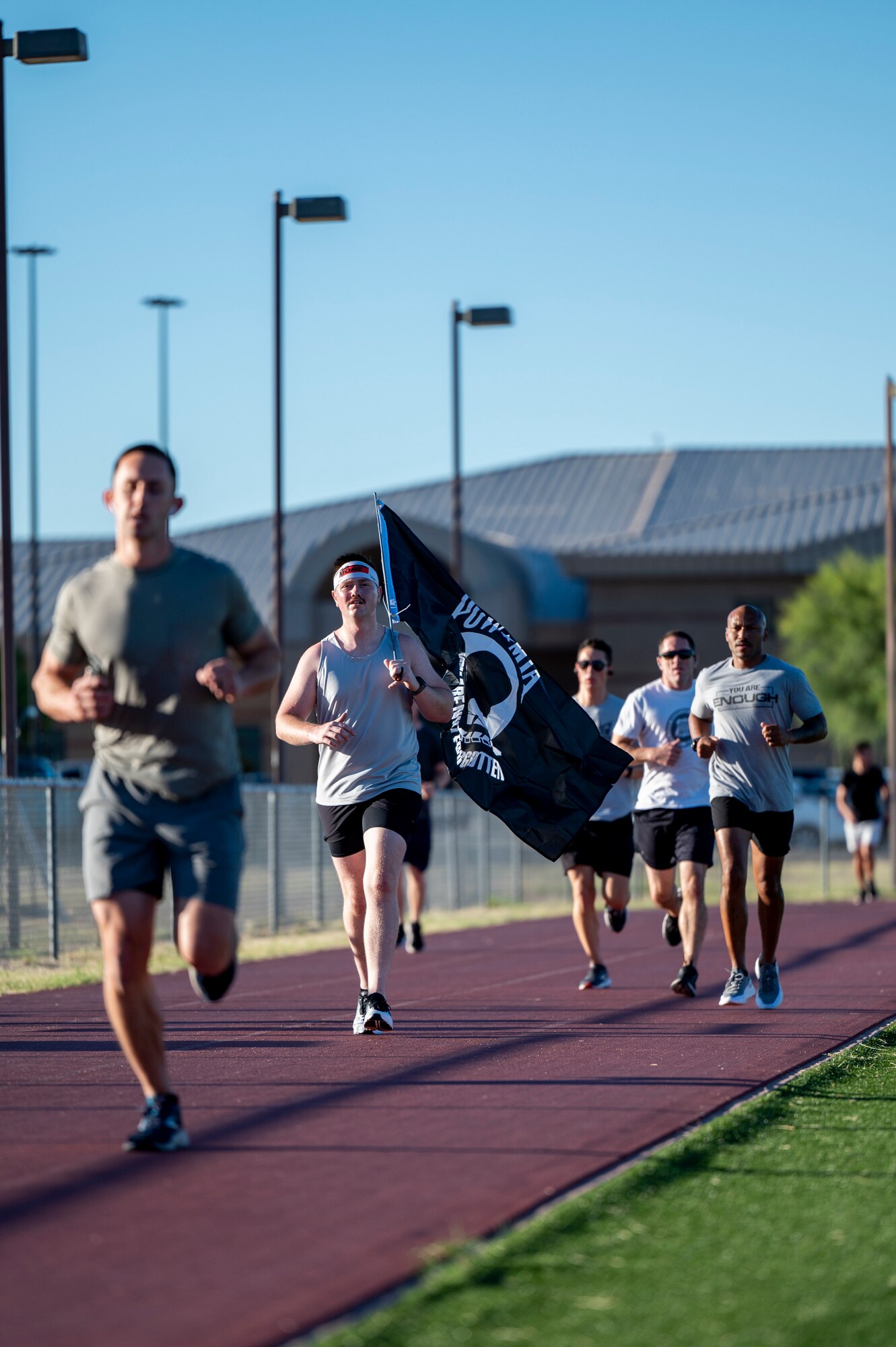 pictured are people running on a track.