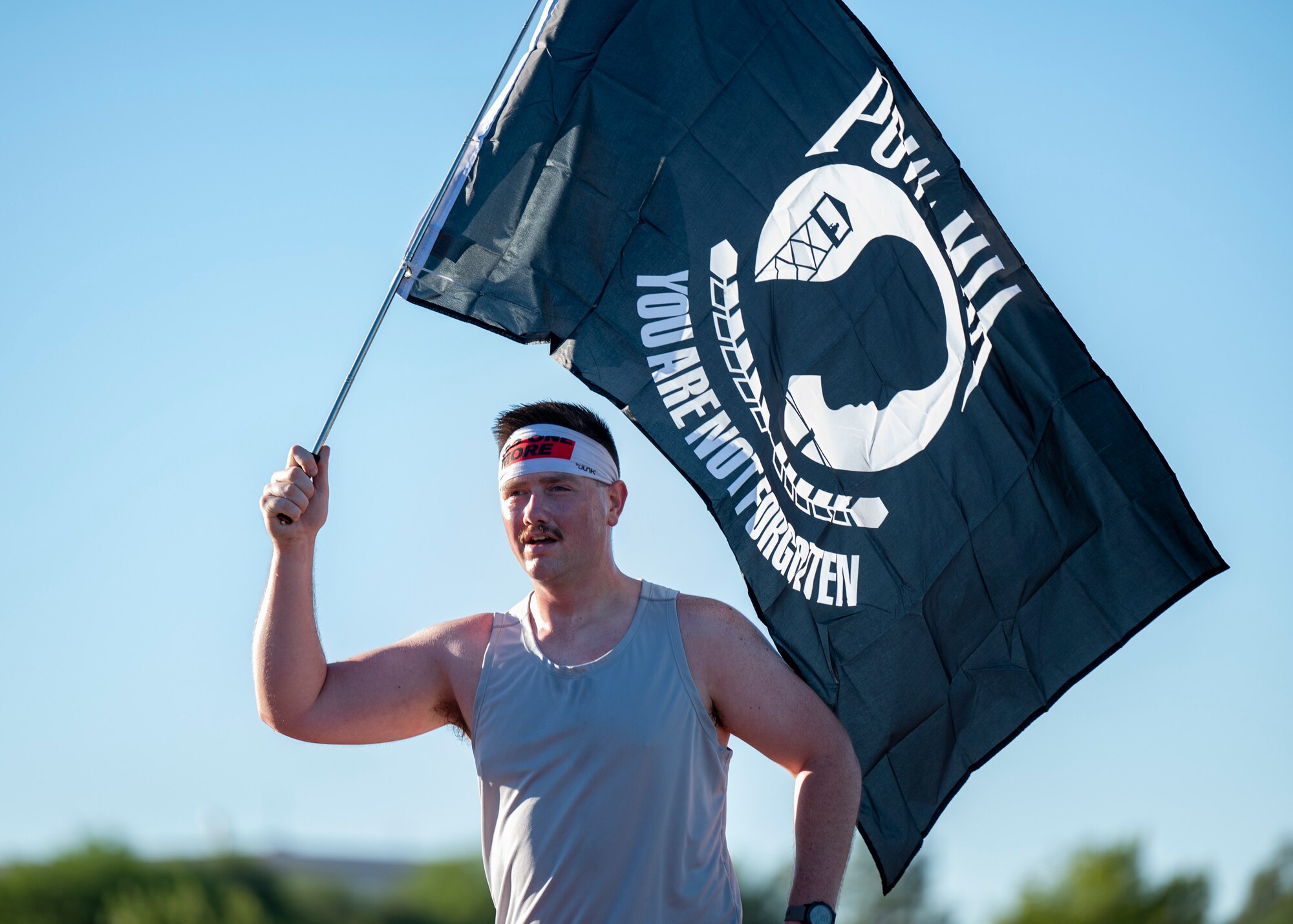 pictured is a person holding a flag.