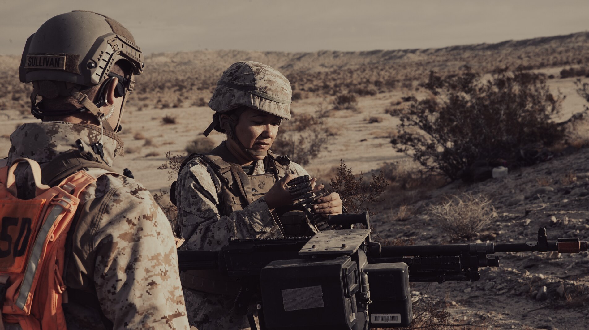 U.S. Marines prepare a small remote-controlled all-terrain vehicle