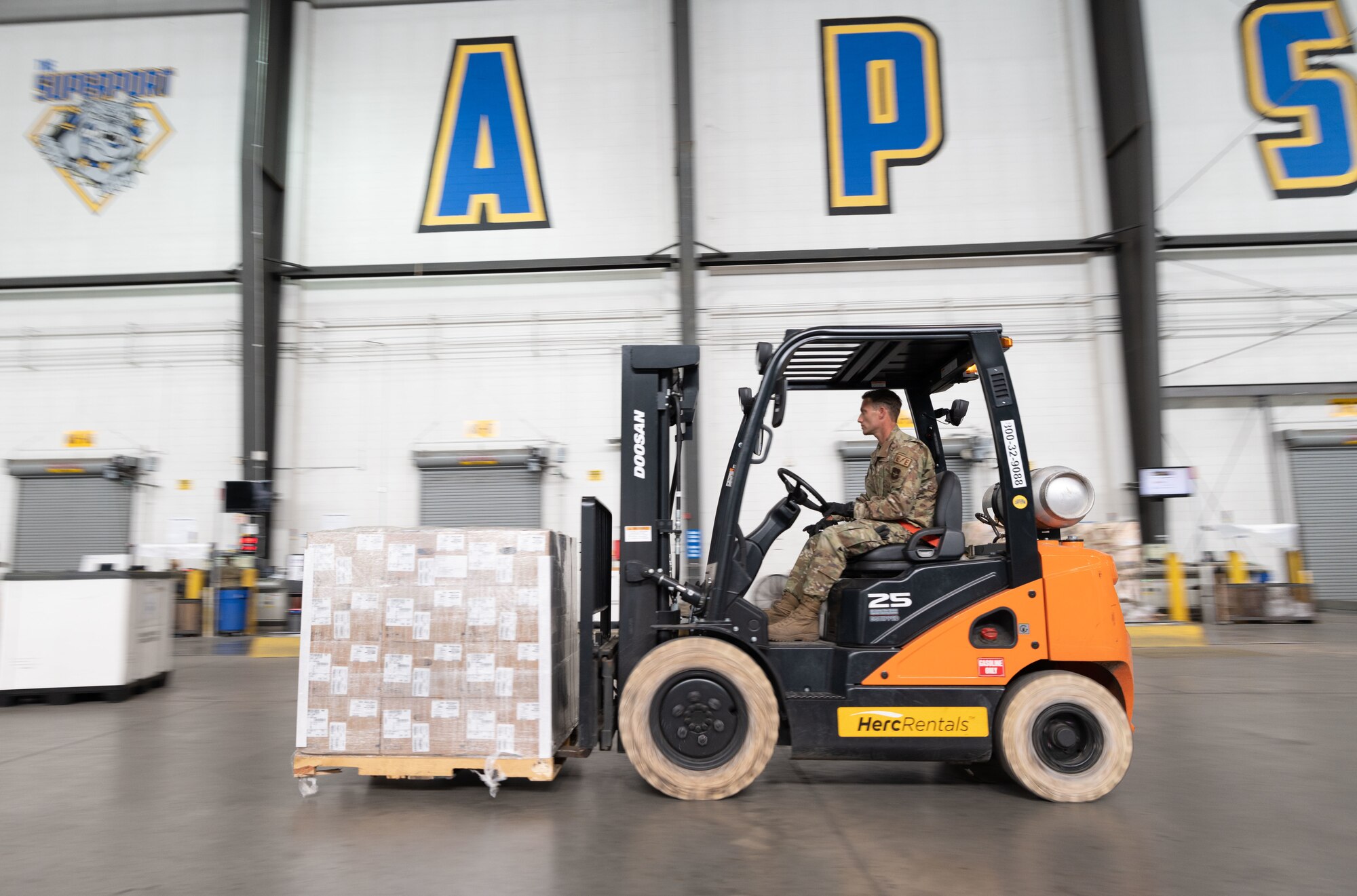 Airman 1st Class Walter Blume, 436th Maintenance Squadron electrical and environmental apprentice, operates a forklift at Dover Air Force Base, Delaware, Sept. 9, 2022. Blume is one of several 436th MXS Airmen that augmented at the 436th Aerial Port Squadron to help alleviate their recent 300% mission surge. The augmentation implements Gen. Charles Q. Brown Jr.'s “Accelerate Change or Lose” action order by utilizing multi-capable Airmen. (U.S. Air Force photo by Senior Airman Cydney Lee)