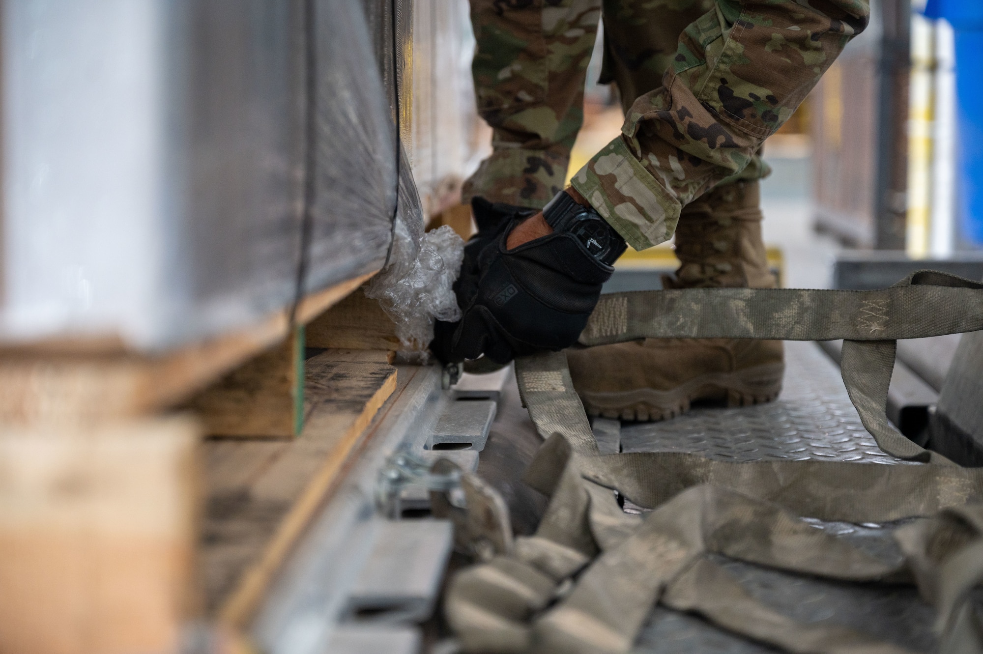 Airman 1st Class Walter Blume, 436th Maintenance Squadron electrical and environmental apprentice, secures cargo at Dover Air Force Base, Delaware, Sept. 9, 2022. Blume is one of several 436th MXS Airmen that augmented at the 436th Aerial Port Squadron to help alleviate their recent 300 percent mission surge. The augmentation implements Gen. Charles Q. Brown Jr.'s “Accelerate Change or Lose” action order by utilizing multi-capable Airmen. (U.S. Air Force photo by Senior Airman Cydney Lee)