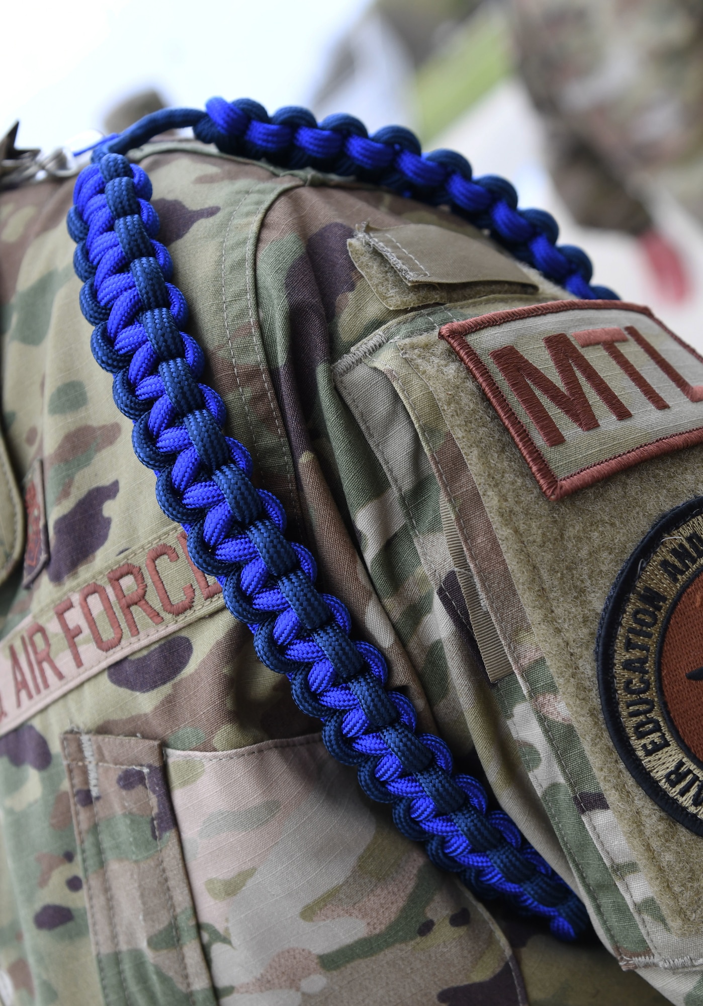 U.S. Air Force Master Sgt. Jessica Johnson, 81st Training Support Squadron military training leader school instructor supervisor, wears a Master Military Training Leader rope outside the Levitow Training Support Facility at Keesler Air Force Base, Mississippi, March 19, 2021. The Master Military Training Leader Program, created at Keesler, was designed to distinguish the military training leaders who have mastered the demonstration, evaluation and reinforcement of military standards; exude military bearing and discipline while scheduling and conducting military training; and are key leaders among Airmen and their peers. (U.S. Air Force photo by Kemberly Groue)