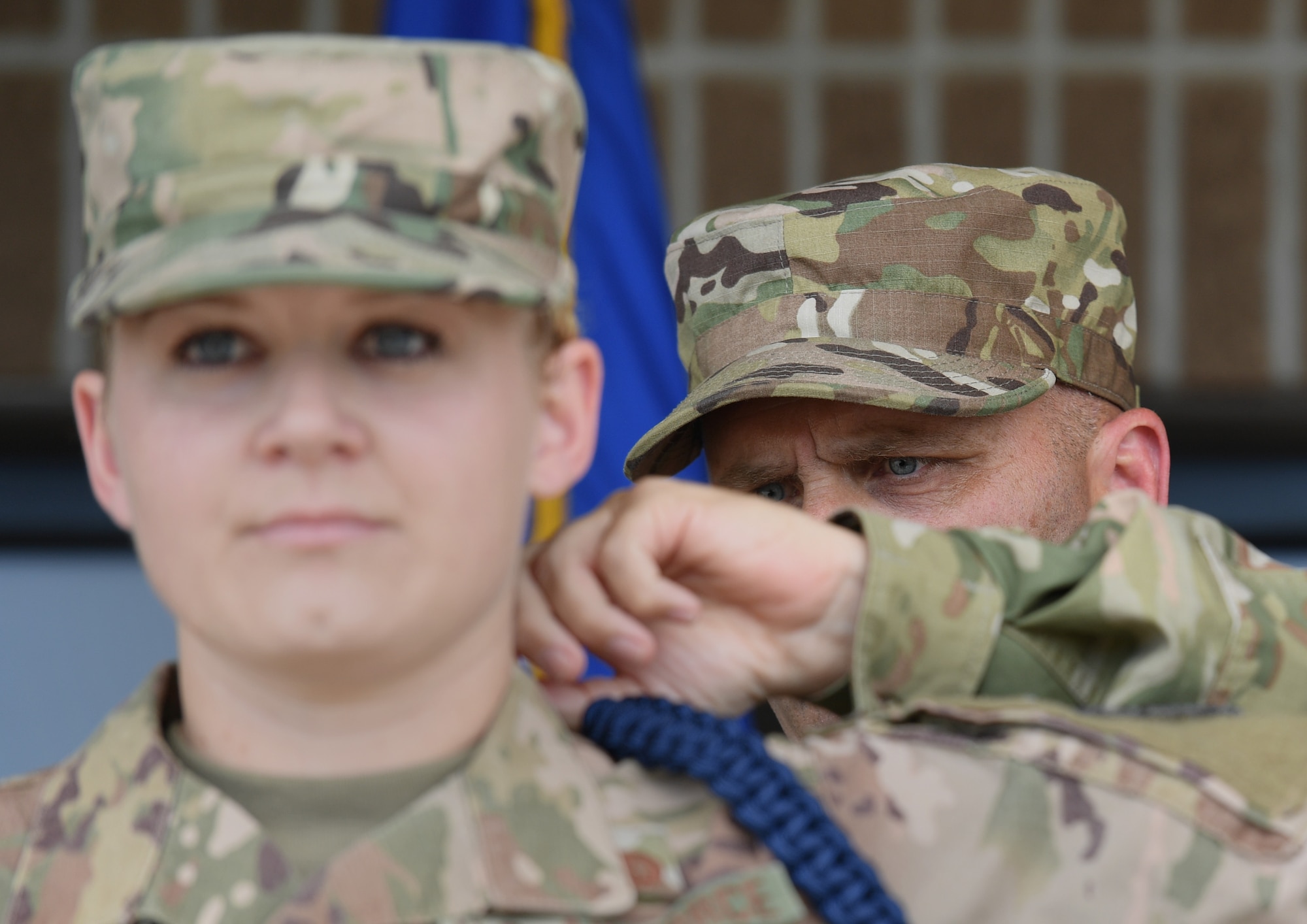 U.S. Air Force Chief Master Sgt. Anthony Fisher, 81st Training Group superintendent, presents a blue rope to Staff Sgt. Ashley Herring, 81st Training Support Squadron military training leader course student, during a MTL course graduation ceremony at the Levitow Training Support Facility on Keesler Air Force Base, Mississippi, May 30, 2019. The MTL course is responsible for training approximately 120 MTLs per year. Those MTLs are then responsible for training approximately 30,000 Airmen in 49 different locations that fall under Air Education and Training Command. (U.S. Air Force photo by Kemberly Groue)