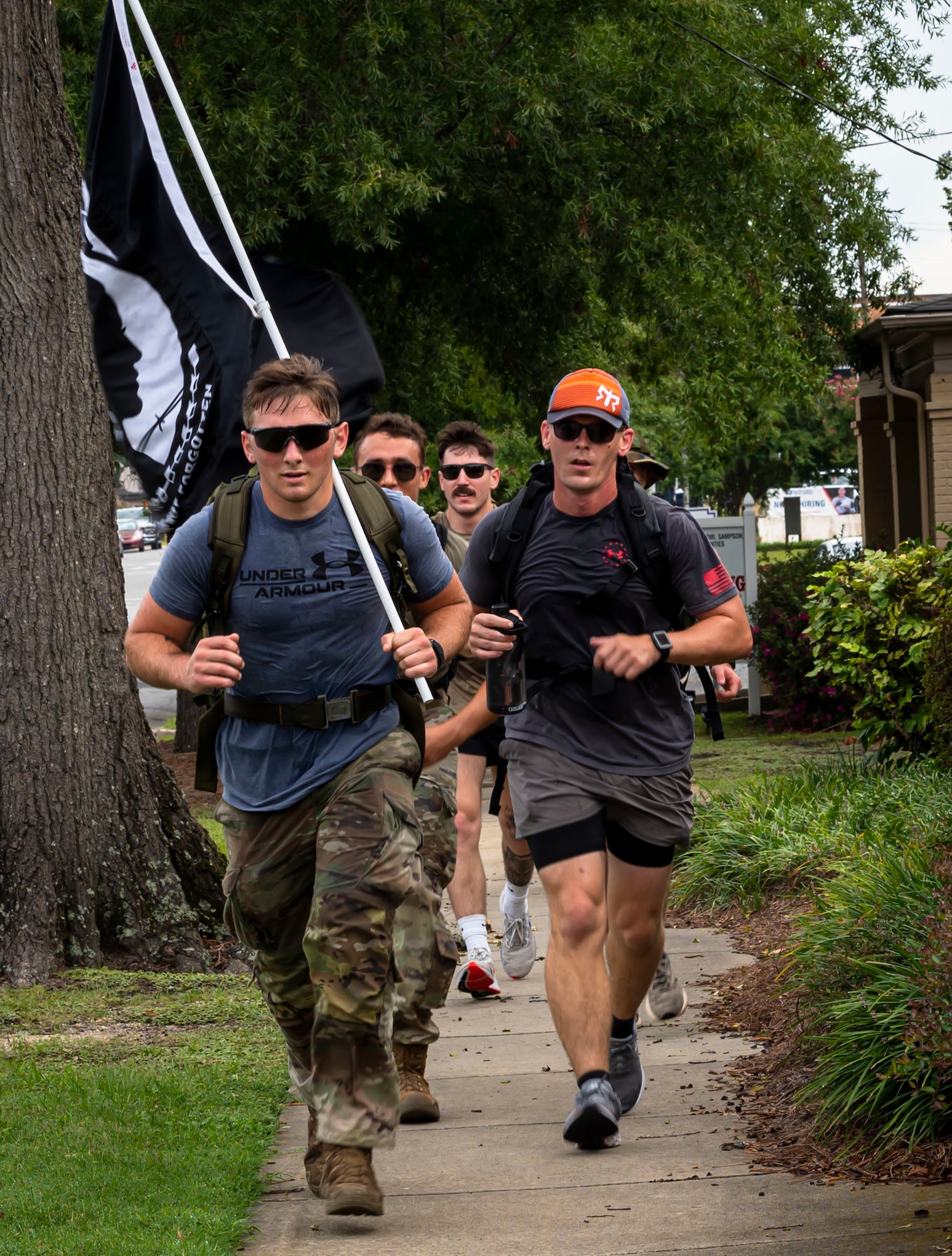 Airmen assigned to the 4th Fighter Wing participate in a ruck march for POW/MIA Remembrance Week at Goldsboro, North Carolina, September 12, 2022. Airmen ran a total of eight miles with the POW/MIA flag from Seymour Johnson AFB to the Wayne Veteran Memorial. (U.S. Air Force photo by Airman 1st Class Sabrina Fuller)