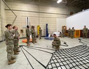 Master Sgt. Rizmel Paguio, center, noncommissioned officer in charge of the U.S. Army Medical Materiel Center-Korea distribution center, conducts sling load training with Army Reserve Soldiers from the 401st Medical Logistics Company during the Ulchi Freedom Shield exercise in August.