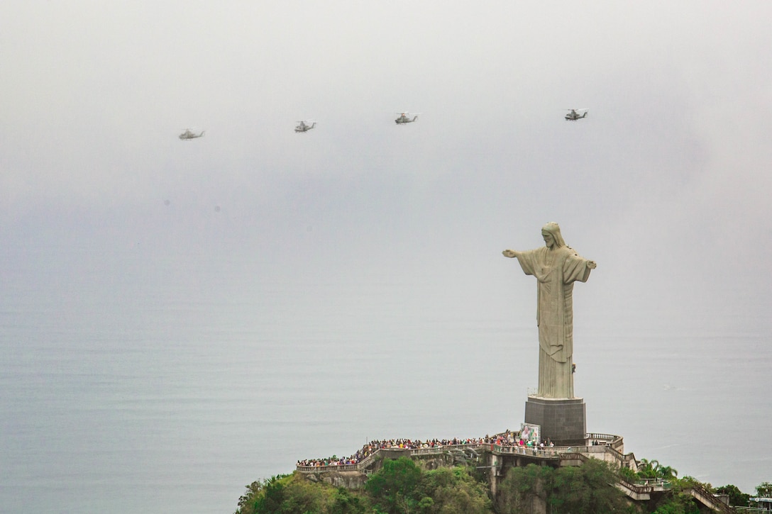 A division of helicopters from Marine Light Attack Helicopter Squadron (HMLA) 773, 4th Marine Aircraft Wing, Marine Forces Reserve in support of Special Purpose Marine Air-Ground Task Force UNITAS LXIII, conduct flight operations near the Christ the Redeemer statue at Corcovado Mountain, Rio de Janeiro, during exercise UNITAS LXIII, Sept. 12, 2022. UNITAS, which is Latin for “unity,” was conceived in 1959 and has taken place annually since first conducted in 1960. This year marks the 63rd iteration of the world’s longest-running annual multinational maritime exercise. Additionally, this year Brazil celebrated its bicentennial, a historical milestone commemorating 200 years of the country’s independence. (U.S. Marine Corps photo by Cpl. Colton K. Garrett)