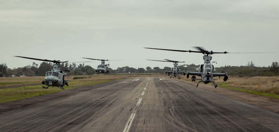 A division of helicopters from Marine Light Attack Helicopter Squadron (HMLA) 773, 4th Marine Aircraft Wing, Marine Forces Reserve in support of Special Purpose Marine Air-Ground Task Force UNITAS LXIII, take off to conduct flight operations near the Christ the Redeemer statue at Corcovado Mountain, Rio de Janeiro, during exercise UNITAS LXIII, Sept. 12, 2022. UNITAS, which is Latin for “unity,” was conceived in 1959 and has taken place annually since first conducted in 1960. This year marks the 63rd iteration of the world’s longest-running annual multinational maritime exercise. Additionally, this year Brazil celebrated its bicentennial, a historical milestone commemorating 200 years of the country’s independence. (U.S. Marine Corps photo by Cpl. Colton K. Garrett)