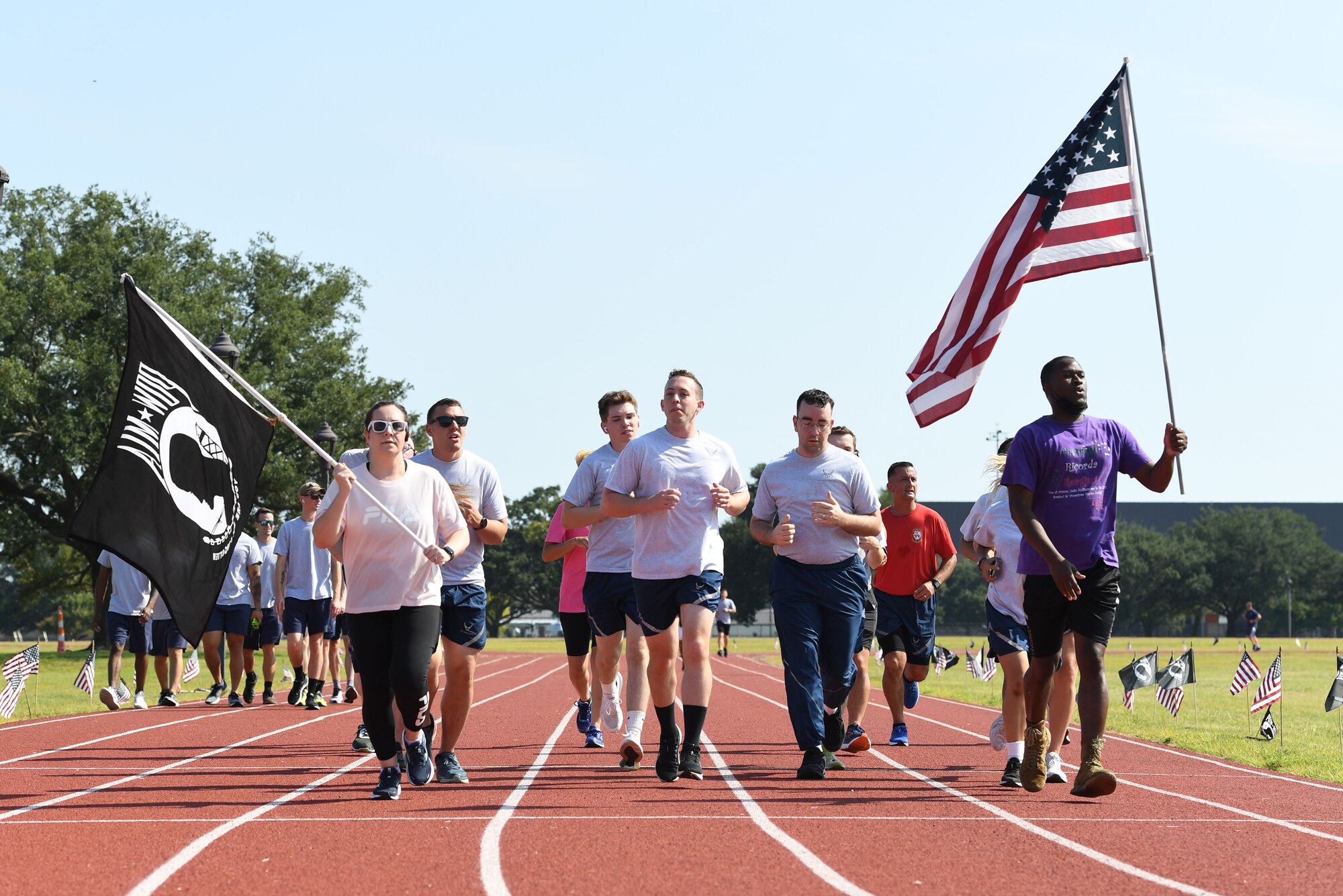 Keesler personnel participate in the POW/MIA run and vigil at the triangle track on Keesler Air Force Base, Mississippi, Sept. 16, 2022. The event, hosted by the Air Force Sergeants Association Chapter 652, is held annually to raise awareness and pay tribute to all prisoners of war and the military members still missing in action. (U.S. Air Force photo by Kemberly Groue)