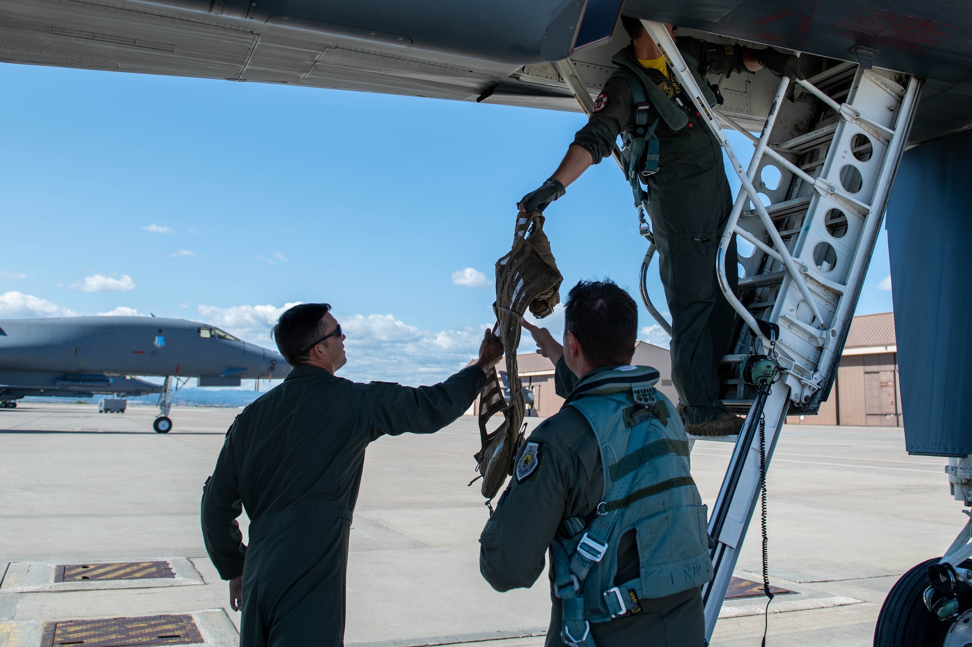 Aircrew assigned to the 37th Bomb Squadron unload equipment from a B-1B Lancer at Ellsworth Air Force Base, S.D., upon completion of a CONUS-to-CONUS (C2C) mission to the Indo-Pacific region, Sept. 10, 2022.