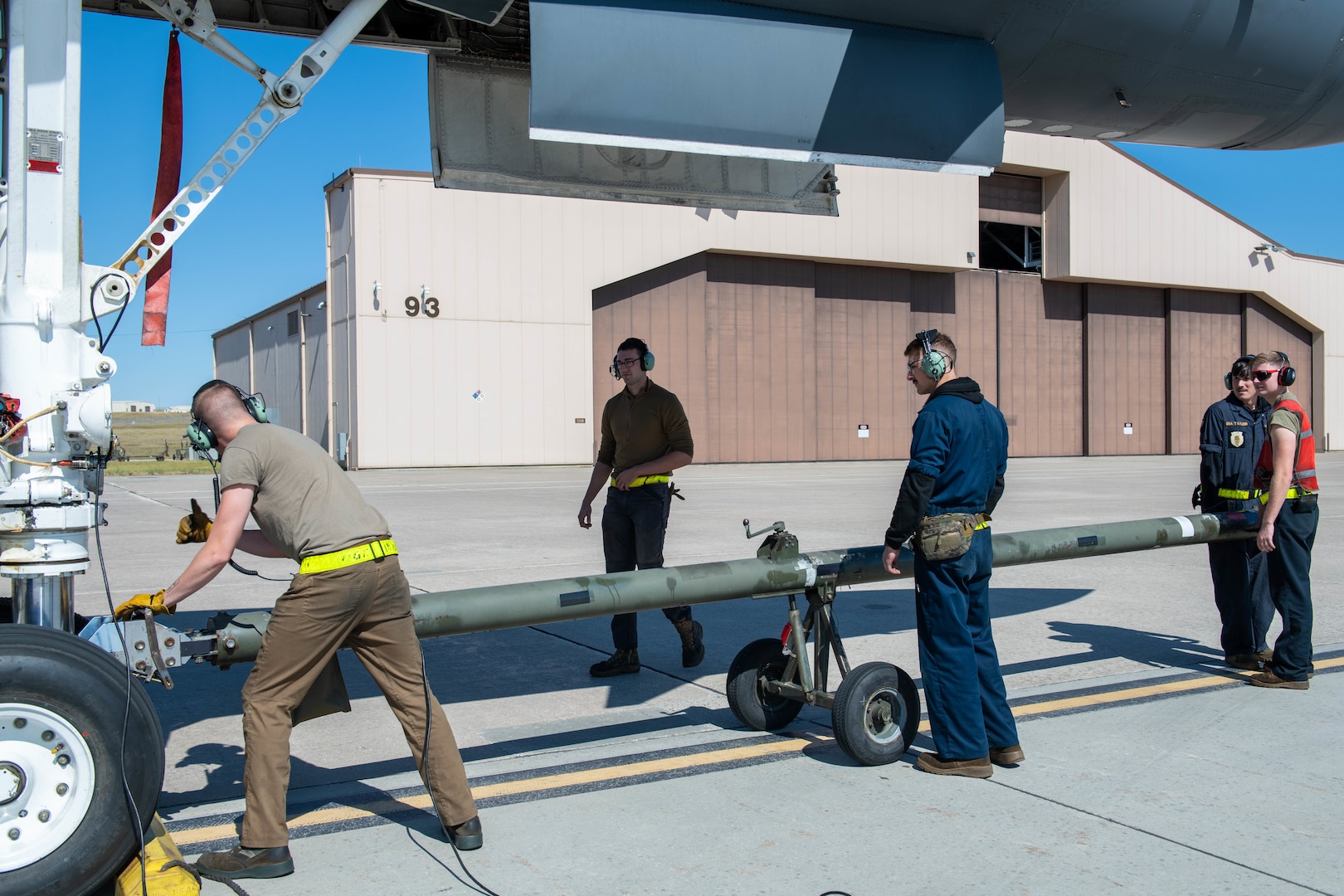 Maintainers from the 28th Aircraft Maintenance Squadron attach a tow bar to a B-1B Lancer at Ellsworth Air Force Base, S.D., Sept. 10, 2022.