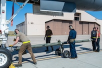 Maintainers from the 28th Aircraft Maintenance Squadron attach a tow bar to a B-1B Lancer at Ellsworth Air Force Base, S.D., Sept. 10, 2022.