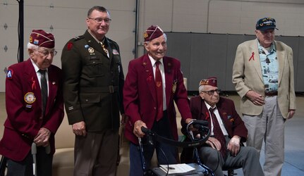 From left: Clyde Cassidy, Maj. Gen. Greg Knight, Richard H. Hamilton, William B. Busier, and Ralph McClintock pose for a photo after a POW/MIA Day observance at Camp Johnson, Vermont, Sept. 16, 2022. Knight is Vermont's adjutant general. Cassidy, Hamilton and Busier are former World War II POWs, and McClintock is a former crew member of the U.S.S. Pueblo, which was captured by North Korea in 1968.